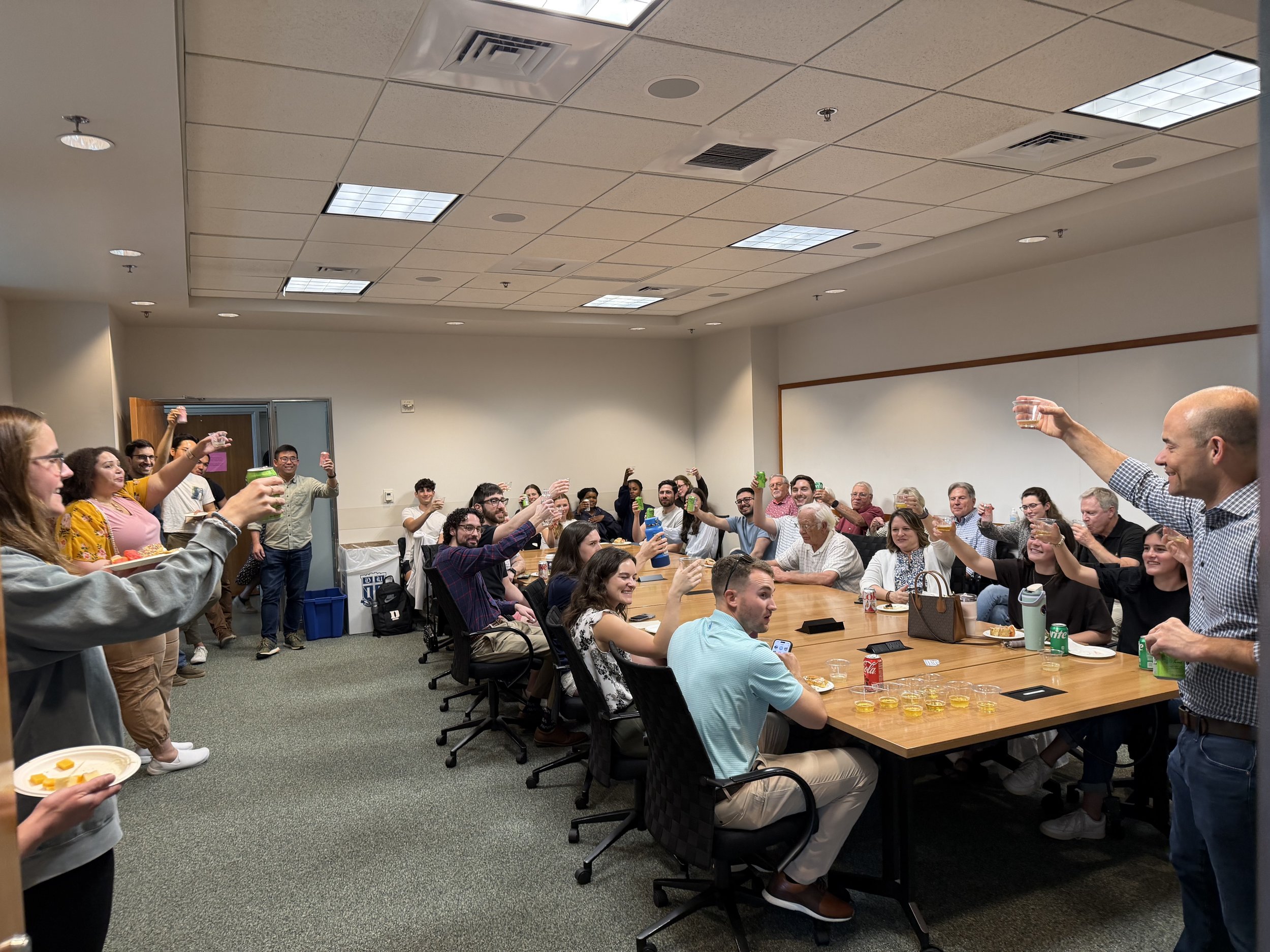 Toasting champagne at Carson's defense celebration.