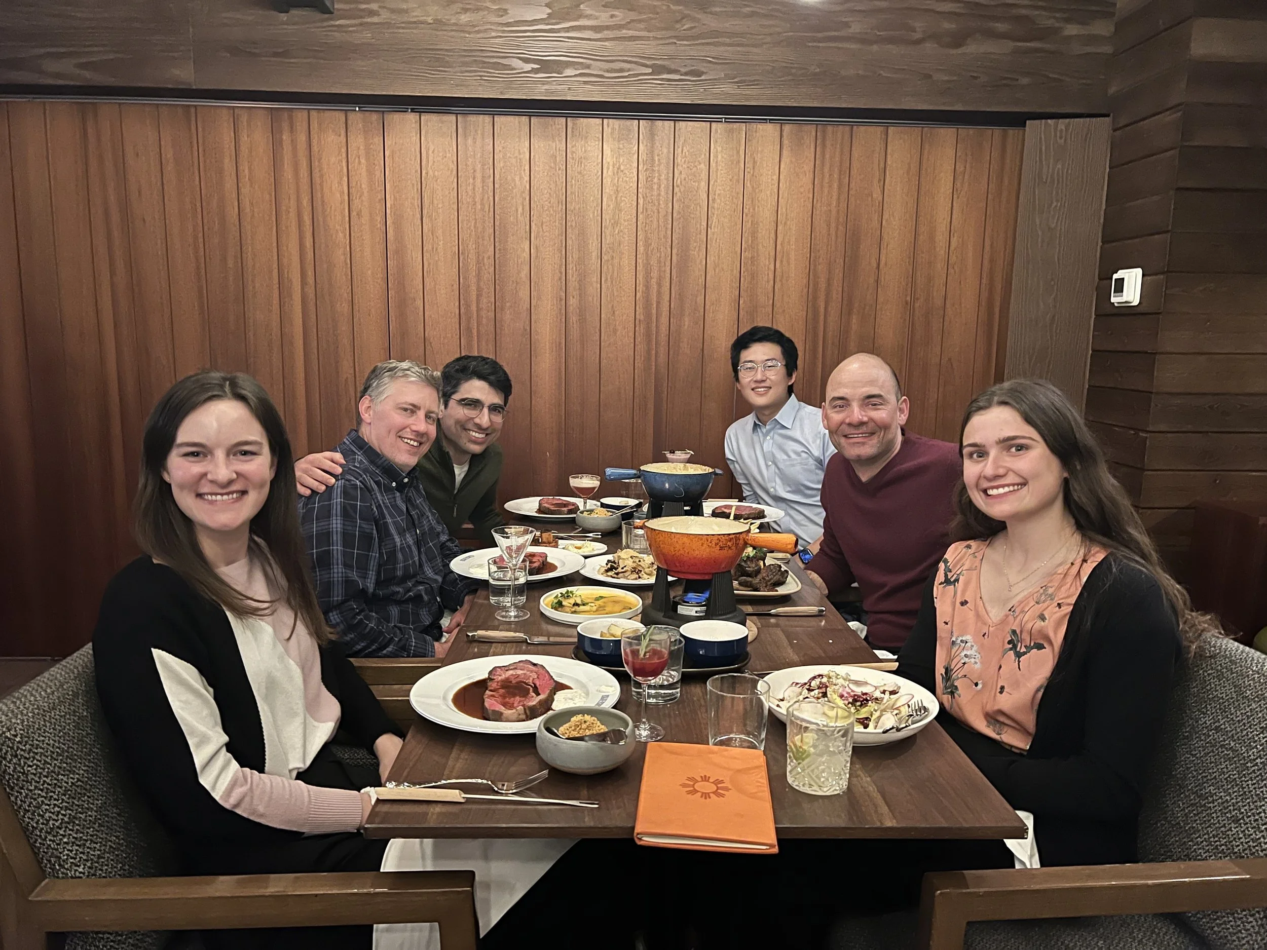 Lab members having dinner together in Banff.