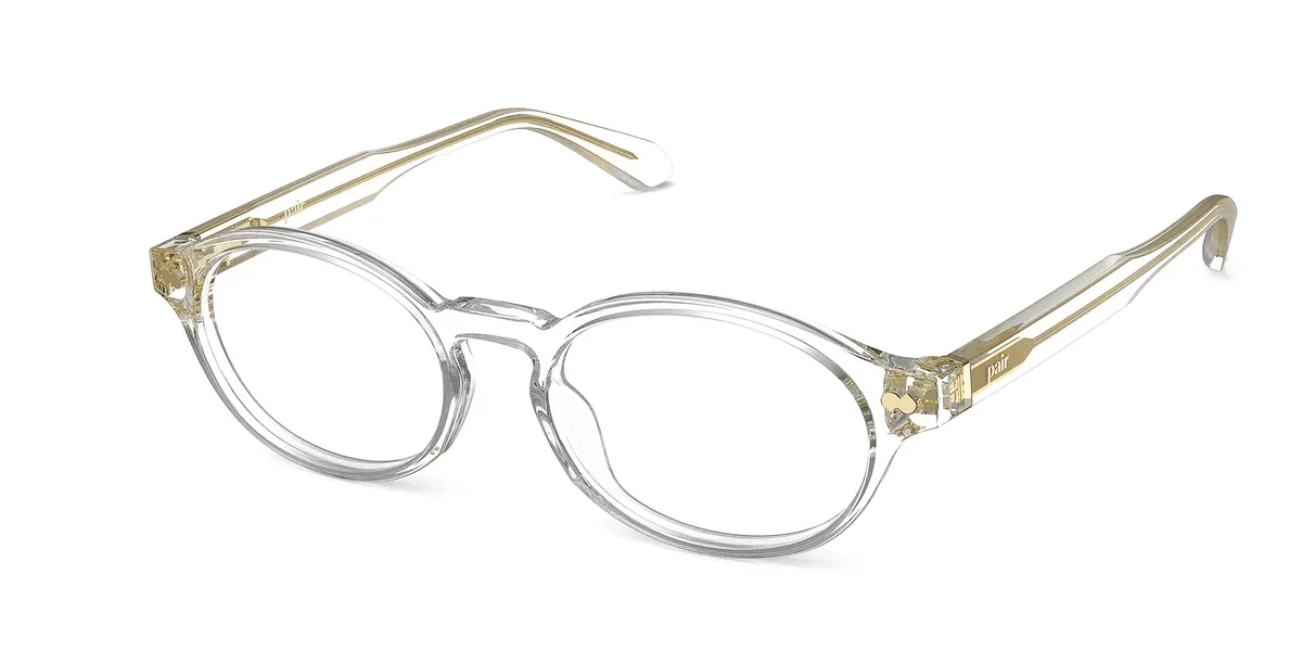 nomi-crystal-clear-acetate-gold-metal-angle.webp