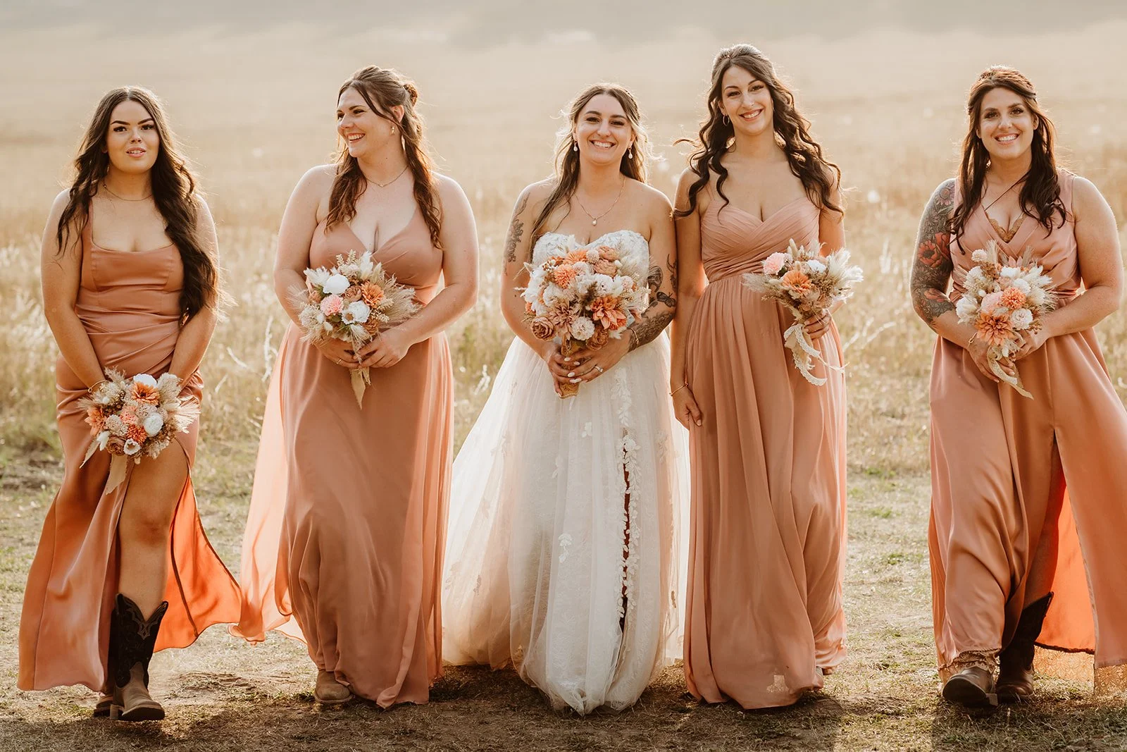 A bride and five bridesmaids, peach coloured bridesmaid dresses, hair styled by Shenara from Bridal Hair by Tara Meghan