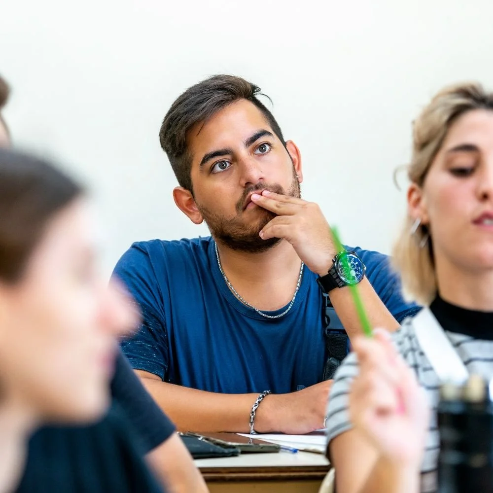 Student appearing distracted during a classroom lecture