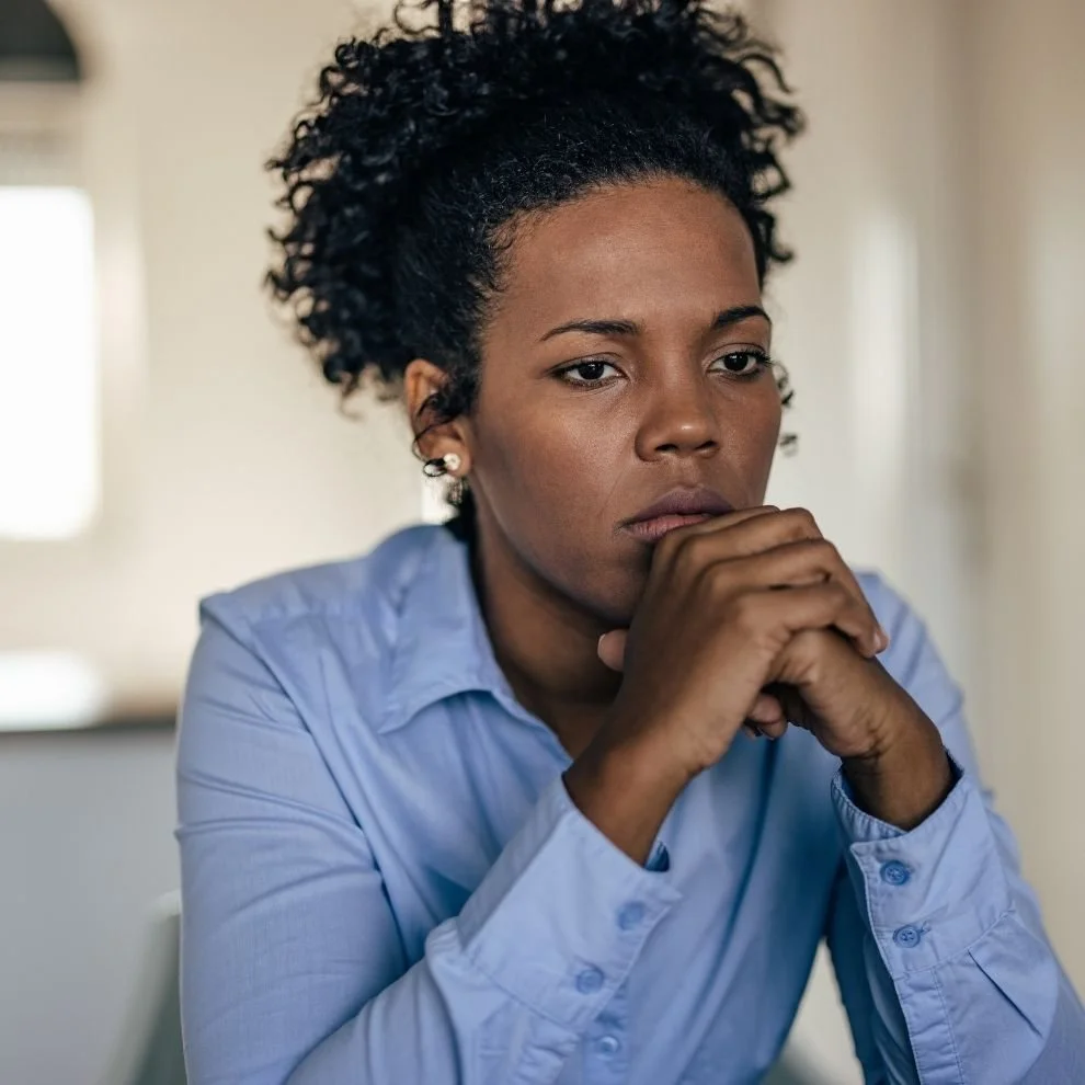 Close-up of woman with serious and reflective expression