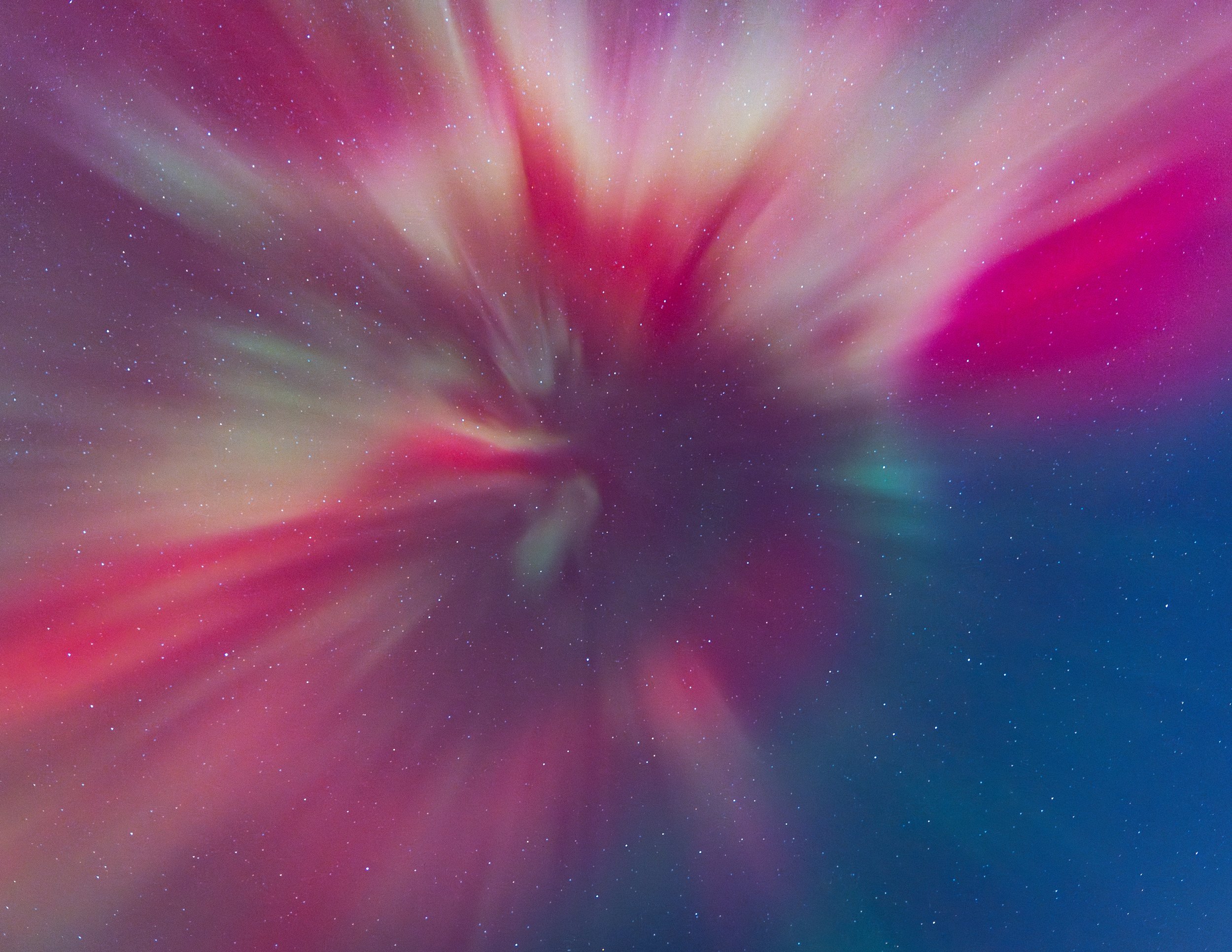 Colorful aurora lights in the night sky with stars scattered throughout.