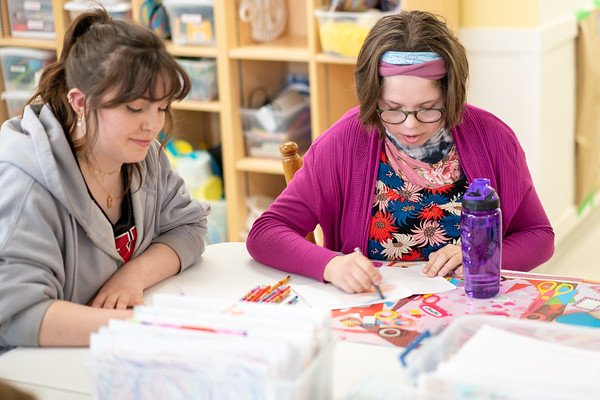 Two women coloring pictures in the L'Arche Homefires arts room. (Copy)