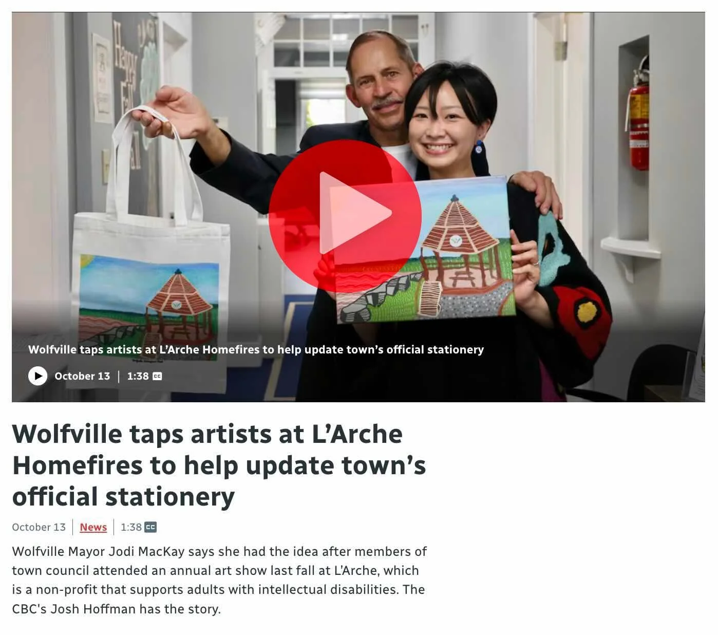 A screenshot of CBC's website showing two people proudly holding their artwork of the Wolfville waterfront.