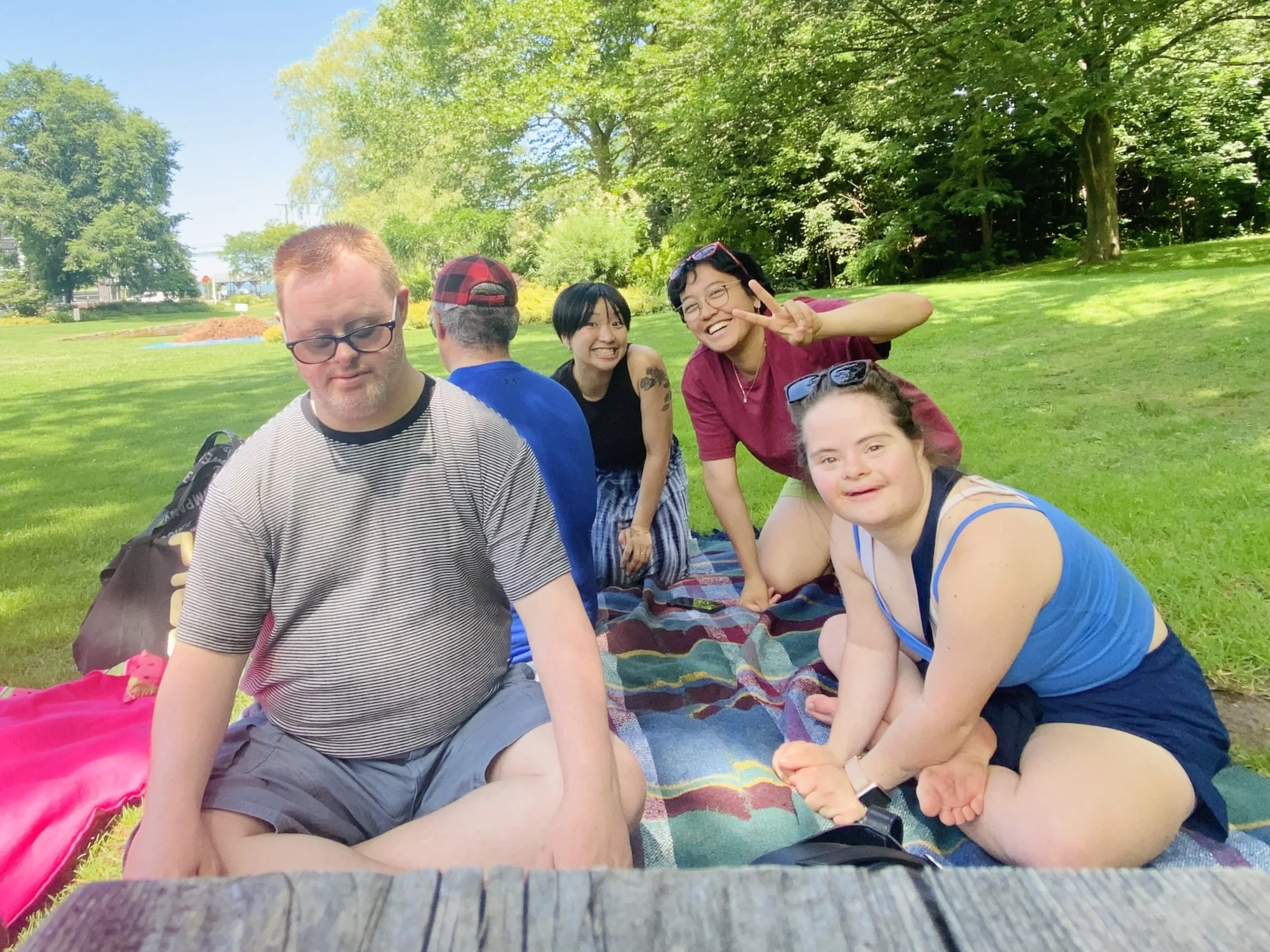 Members posing for a picture at a picnic