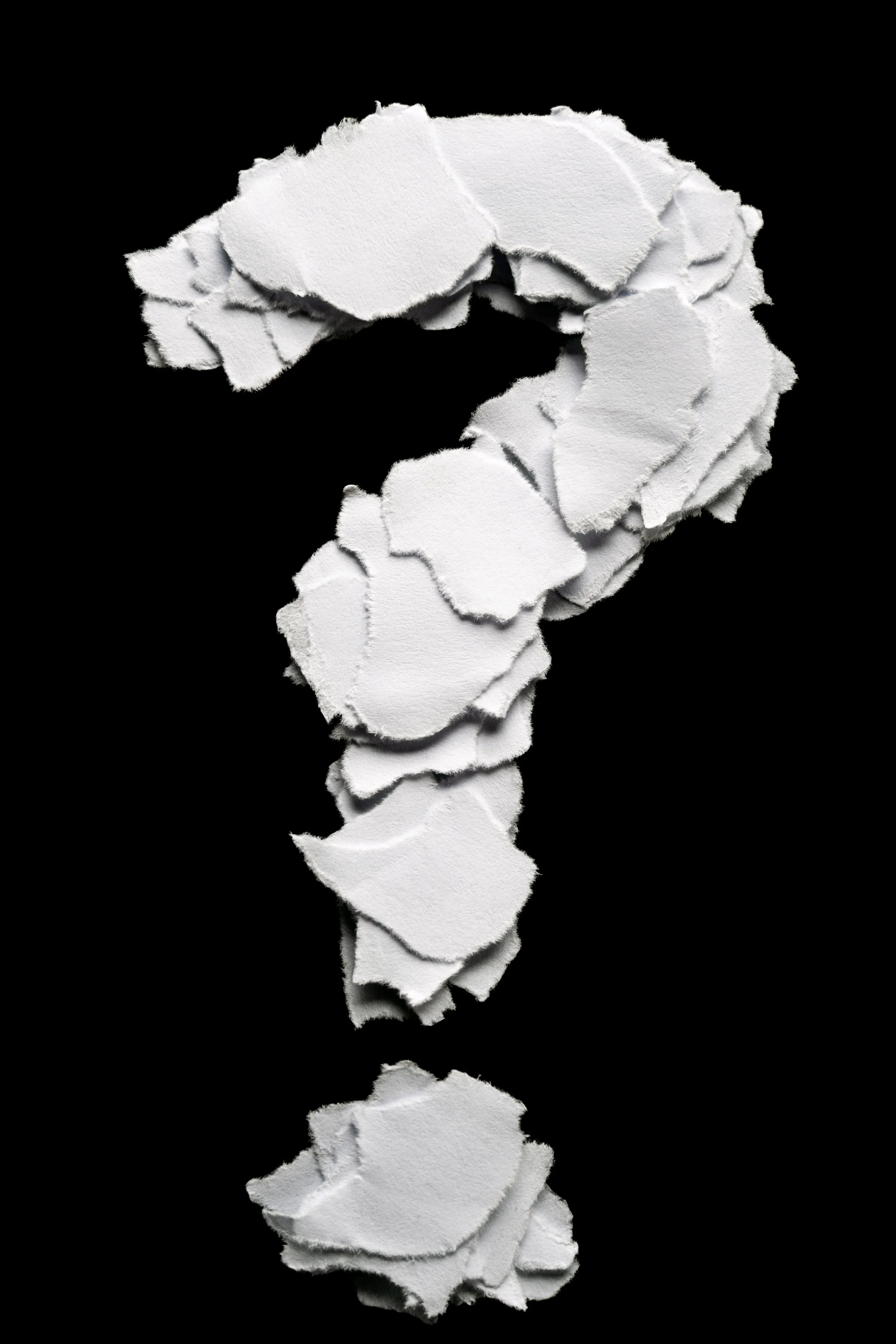 Torn paper question mark representing curiosity and inquiry.