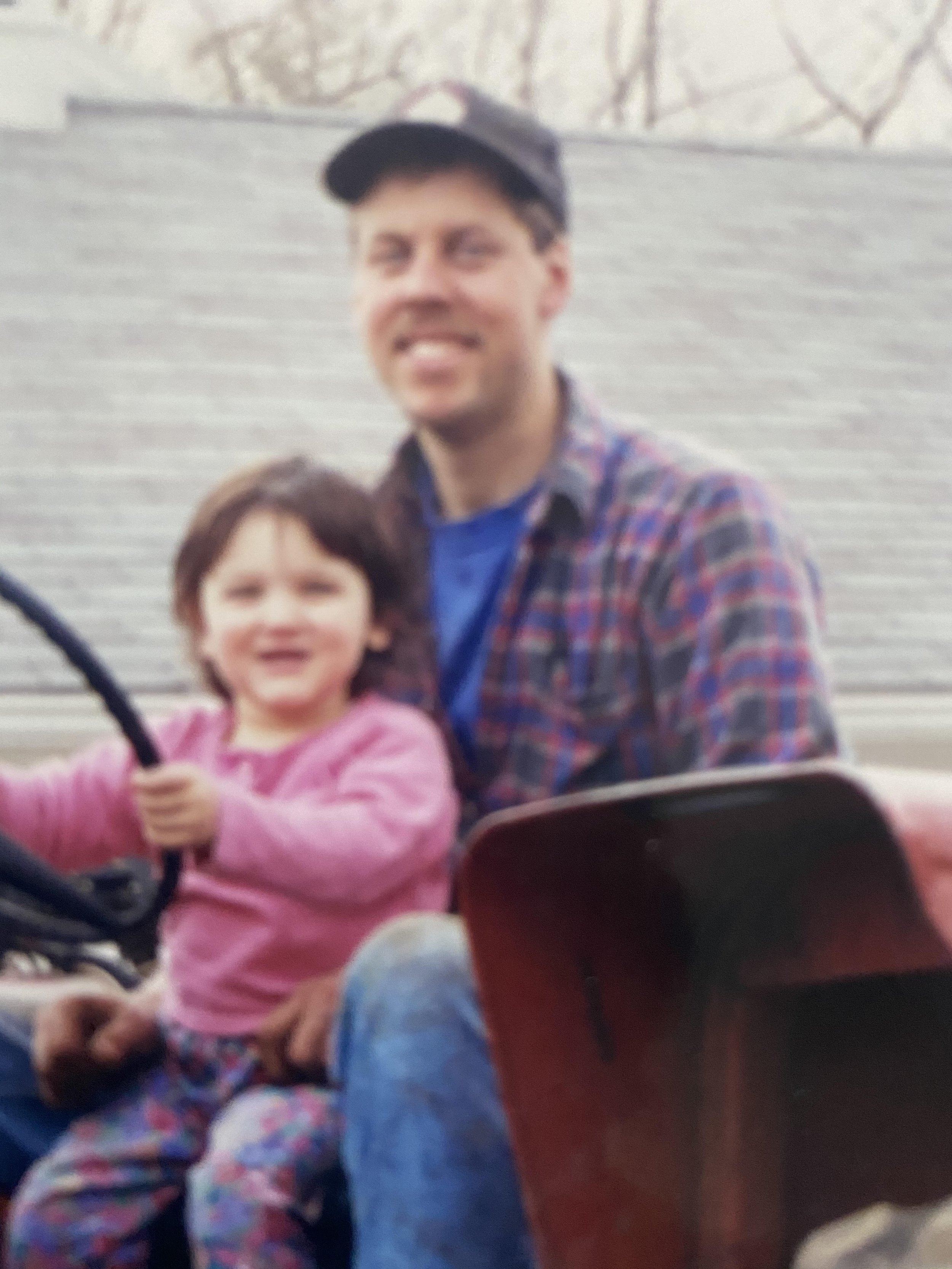 father and daughter on tractor 
