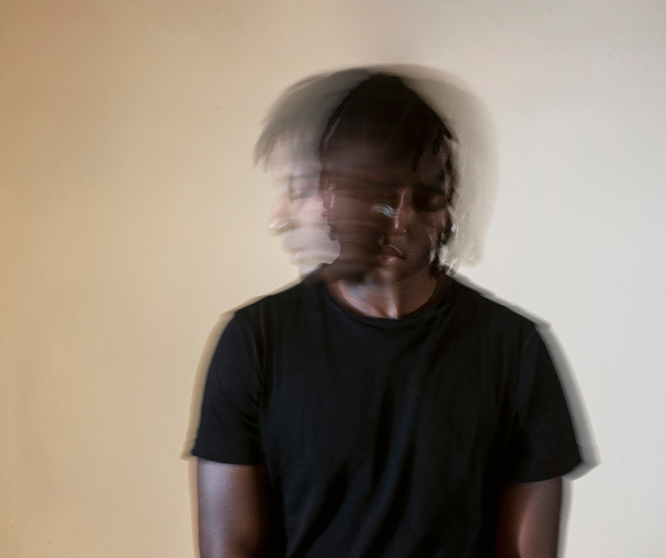 blurry photo of African American man moving his head back and forth