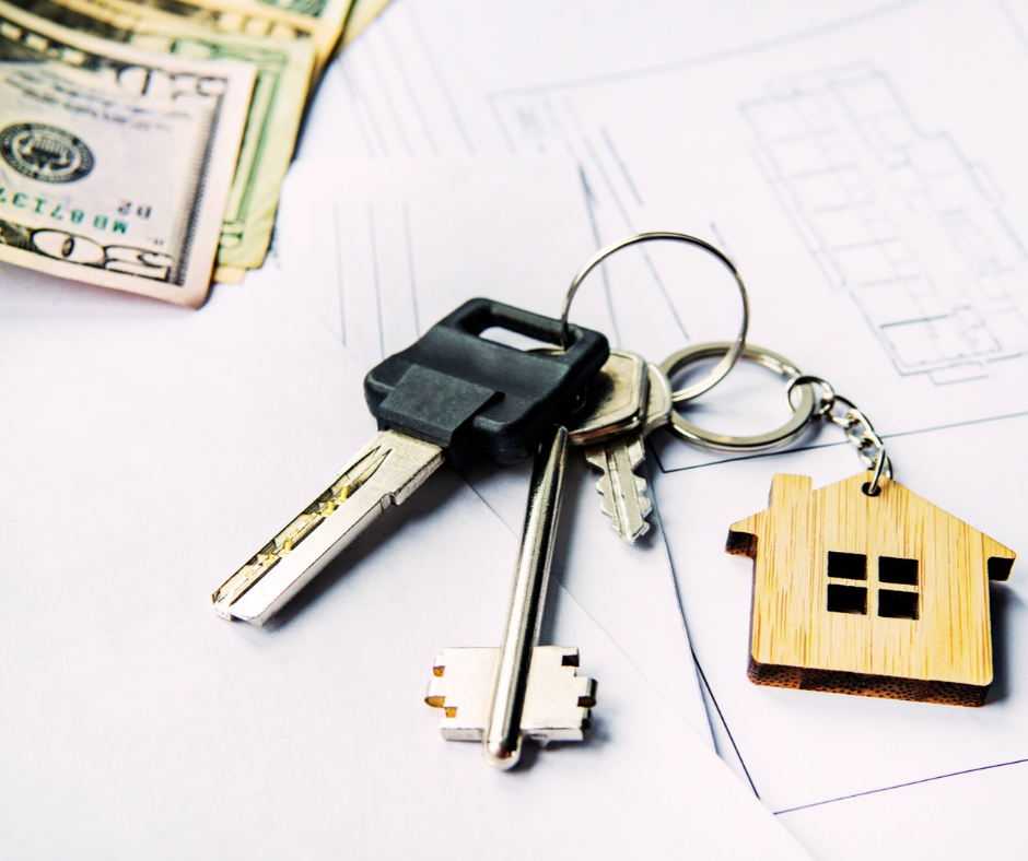 floor plan and blueprint with house keys laying on top of it and stack of money