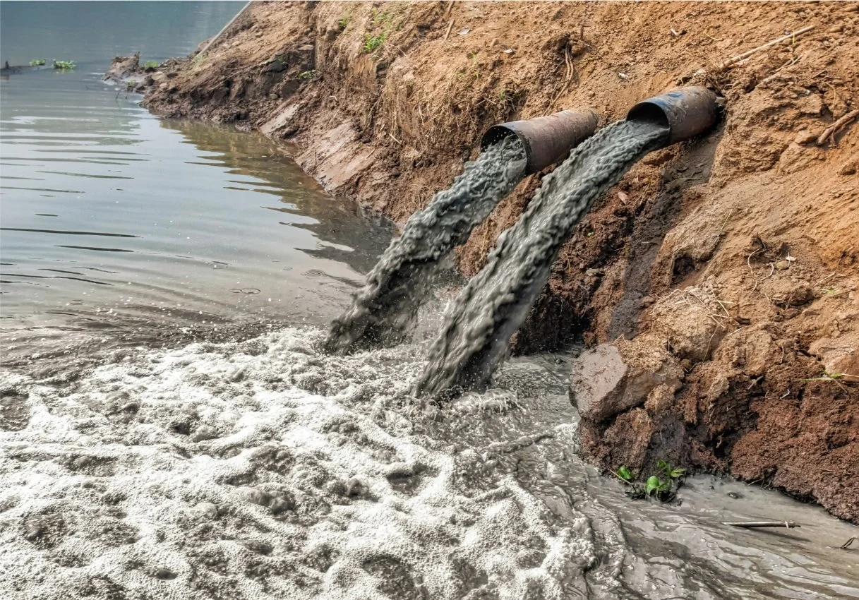 Toxic waste pouring into a river