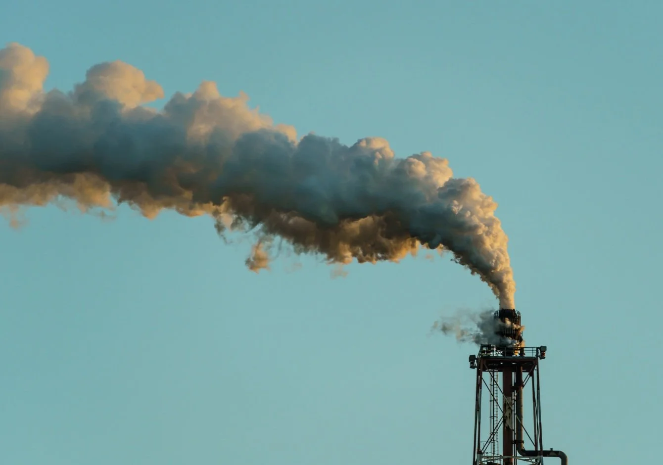 An industrial chimney expelling lots of smoke
