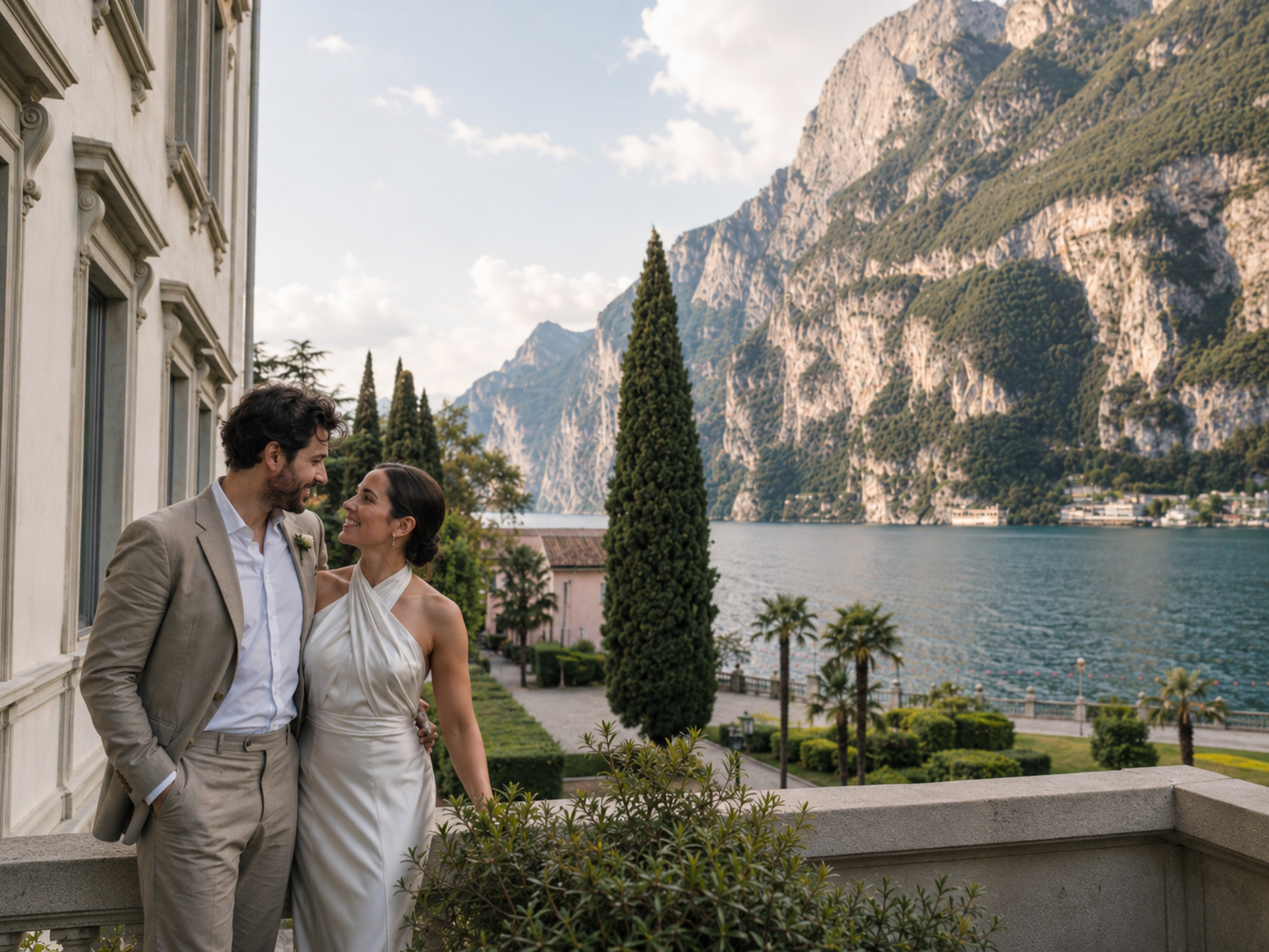 Romantic wedding couple portrait at Lido Palace in Riva del Garda with dramatic mountain and lake views, elegant Northern Italy destination wedding photography with cinematic light and natural emotion.