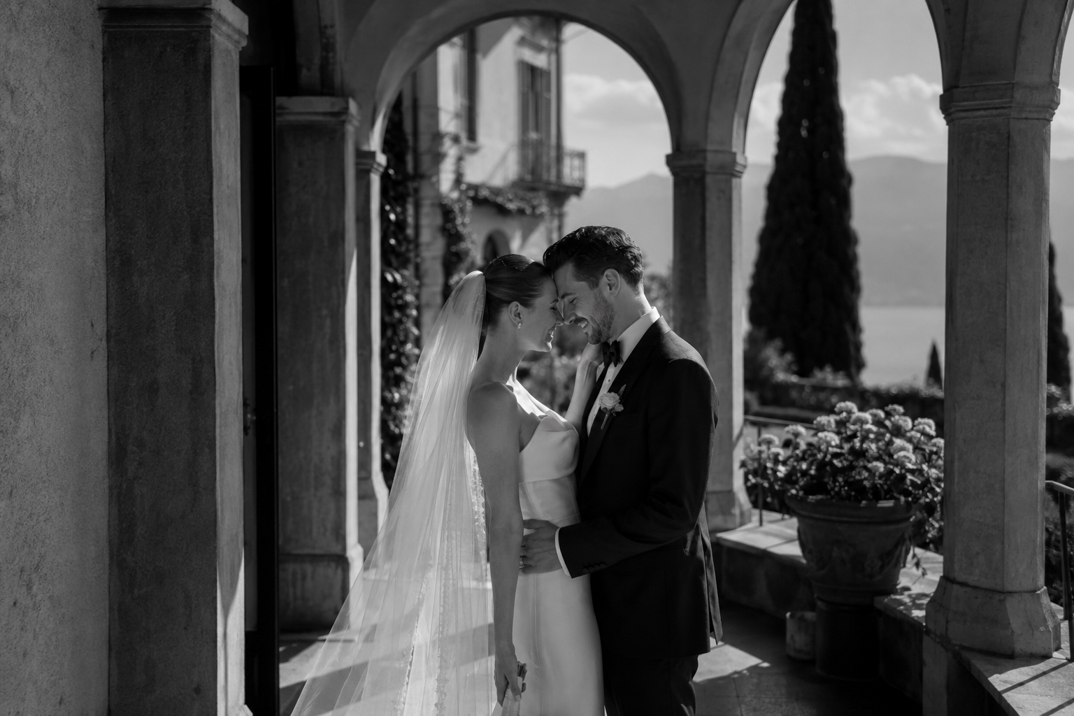 Bride and groom during intimate couple portraits at a luxury Lake Garda wedding overlooking the Italian lake.
