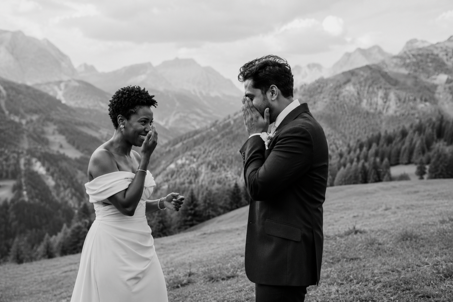 Bride and groom sharing an emotional first look in the Dolomites before their intimate mountain wedding ceremony.