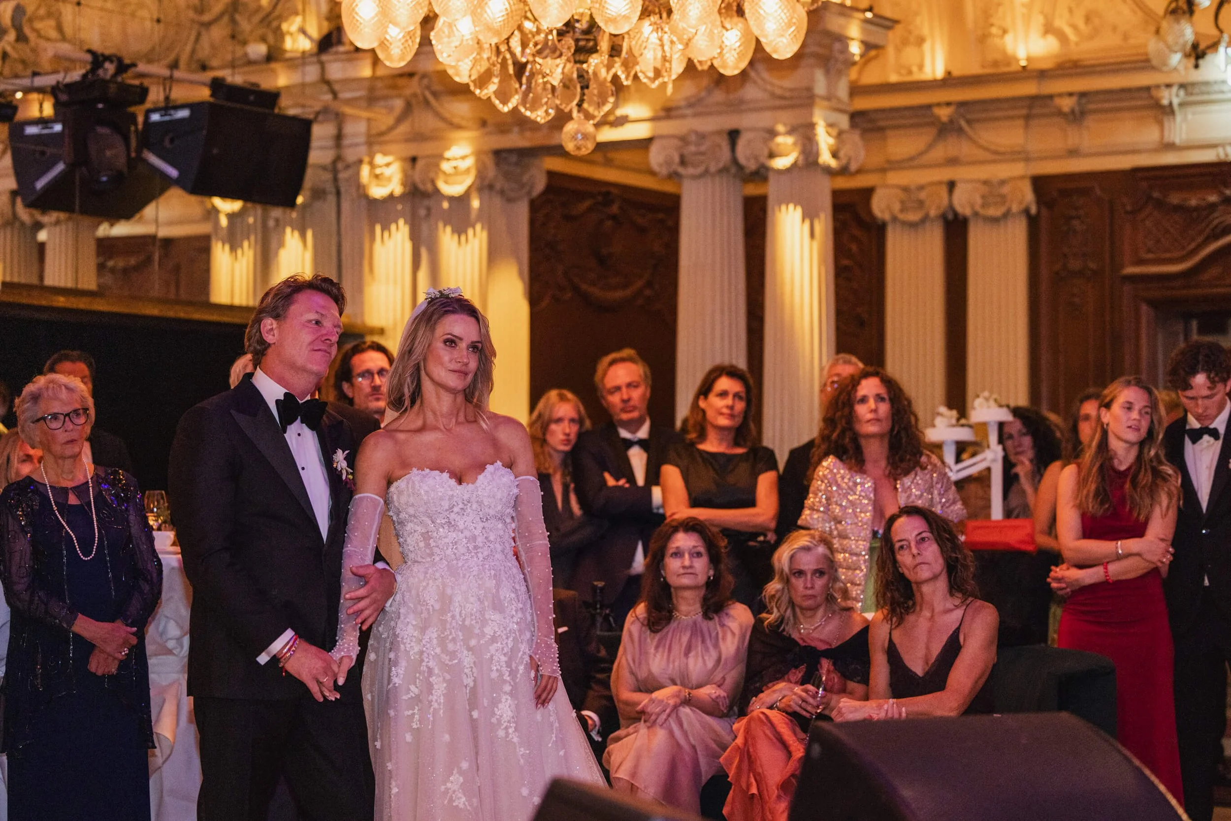 Couple watching a live musical performance during their Café Opera wedding reception