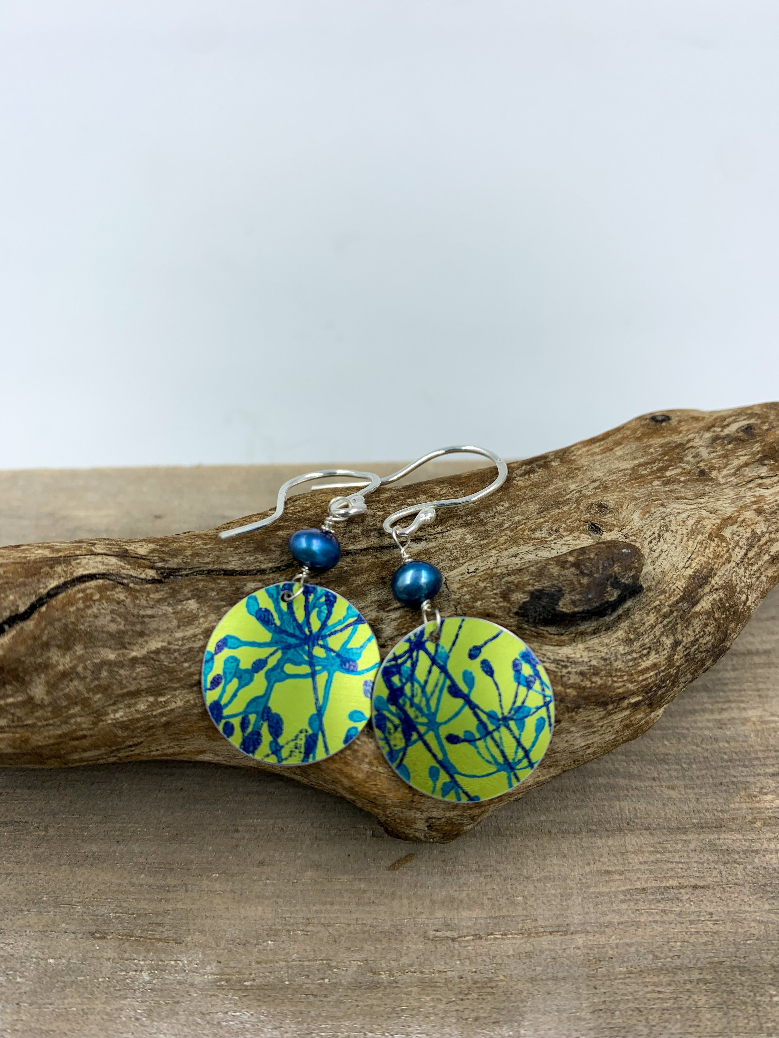 lime green cow parsley print circle earrings with blue pearl