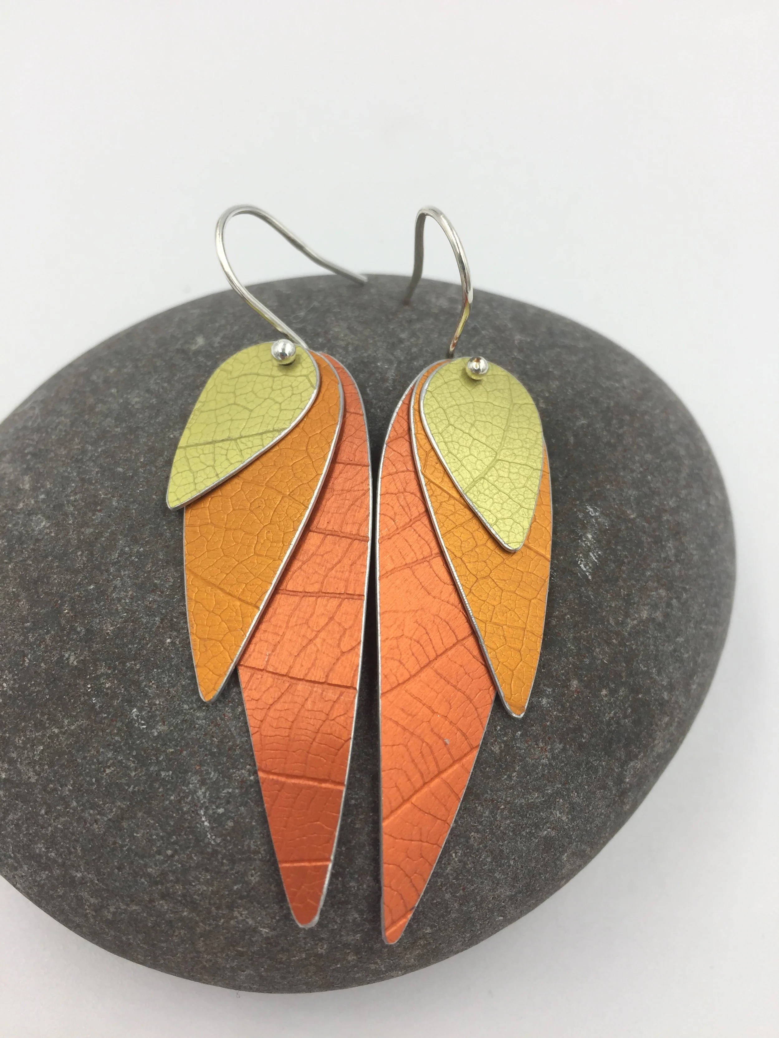 three layered parrot wing earrings orange and yellow