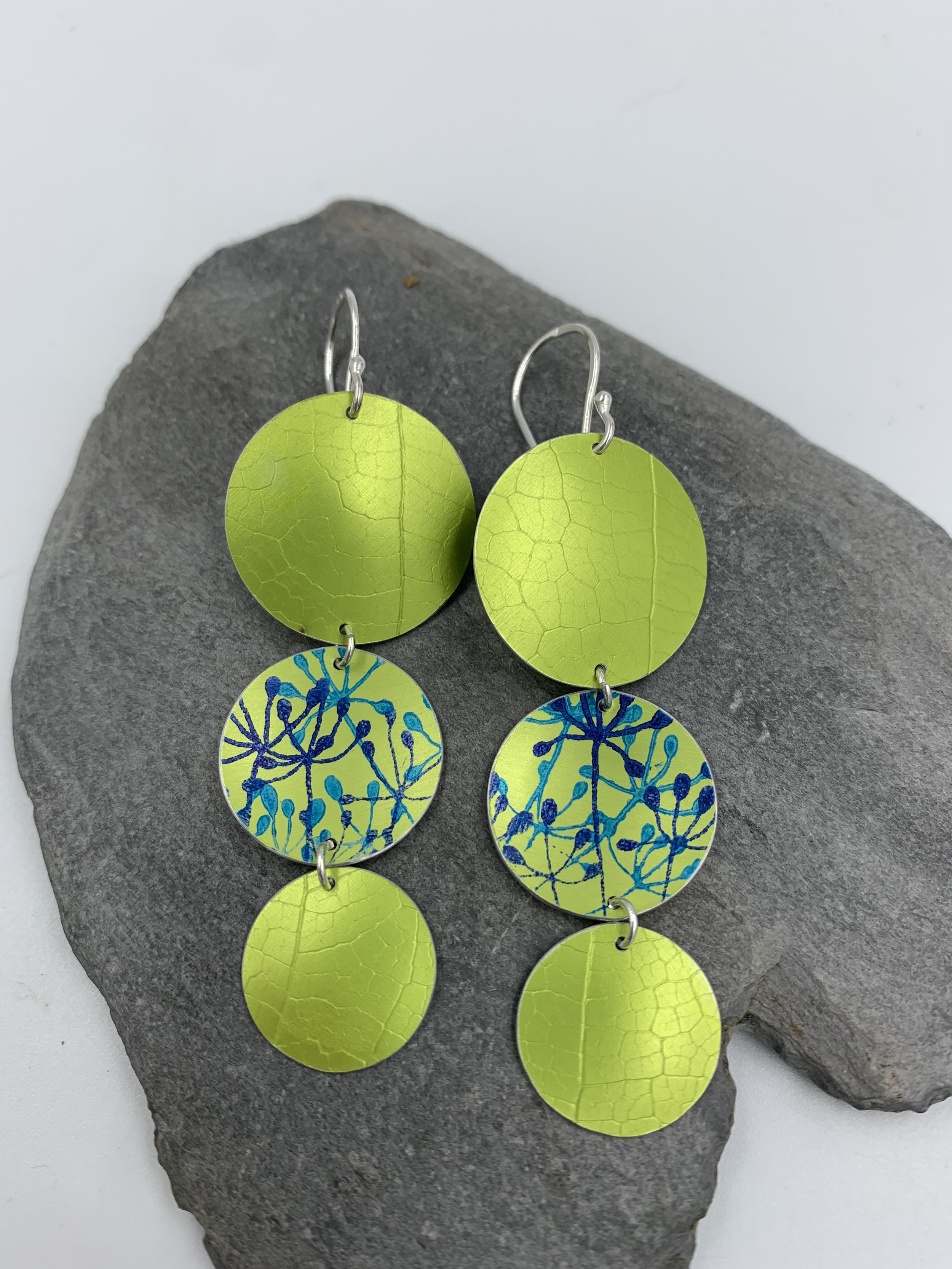 leaf textured 3 circle lime green dangly earrings with cow parsley print