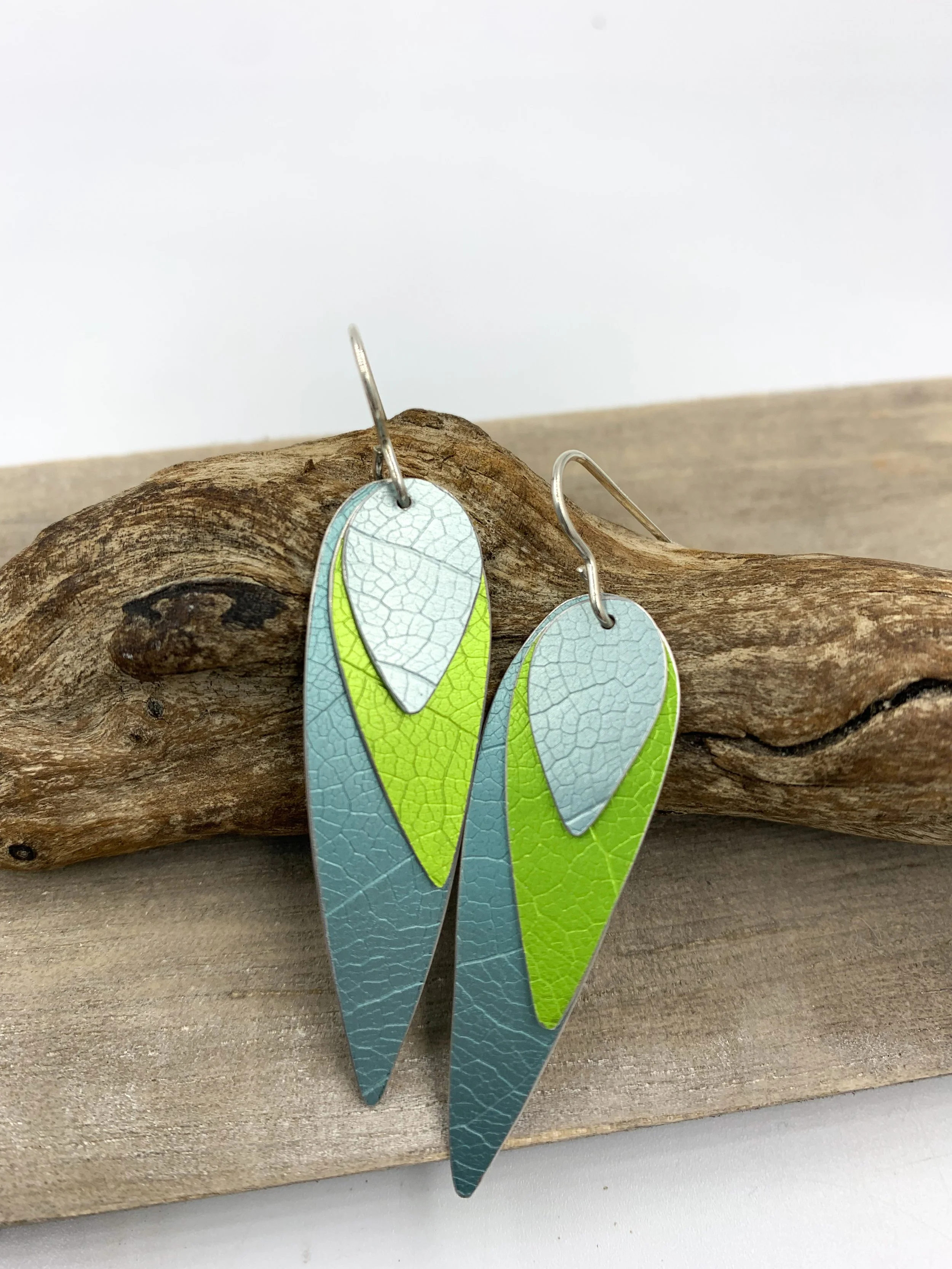 three layered parrot wing earrings teal and lime green