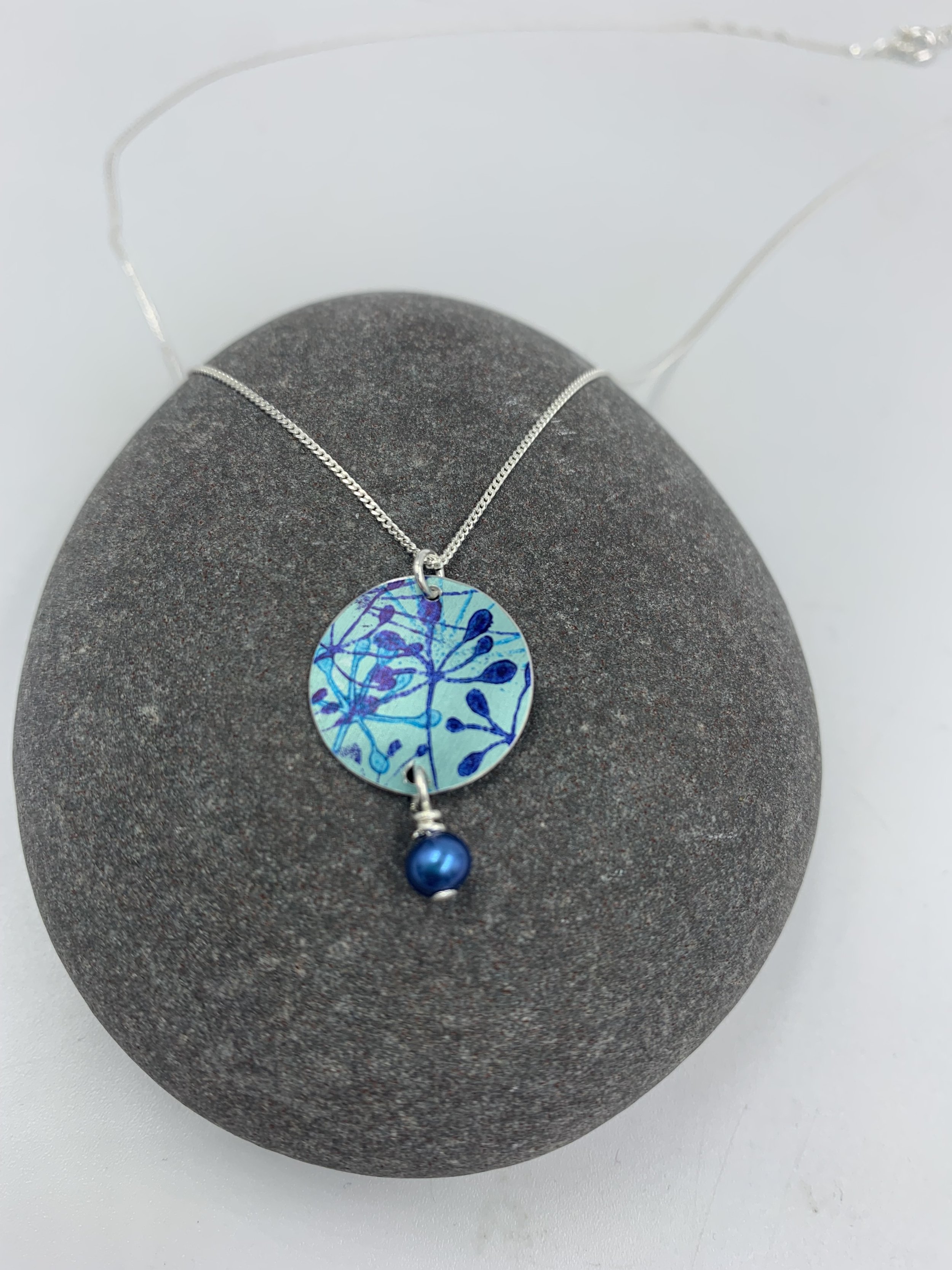 teal cow parsley print circle necklace with blue pearl