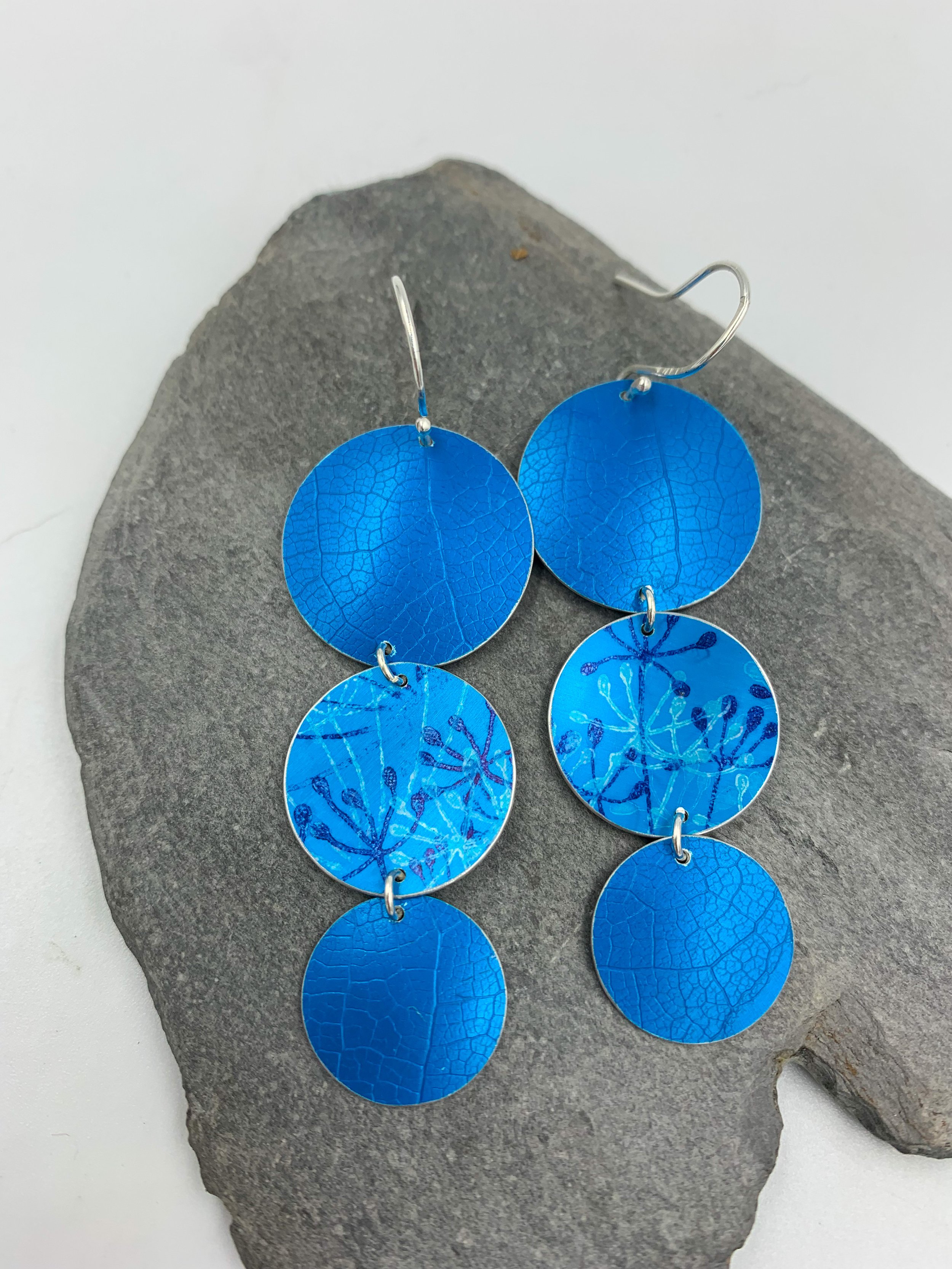 leaf textured 3 circle turquoise dangly earrings with cow parsley print