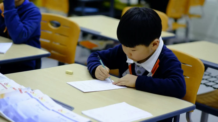 Child preparing for academic and social success with classroom routines