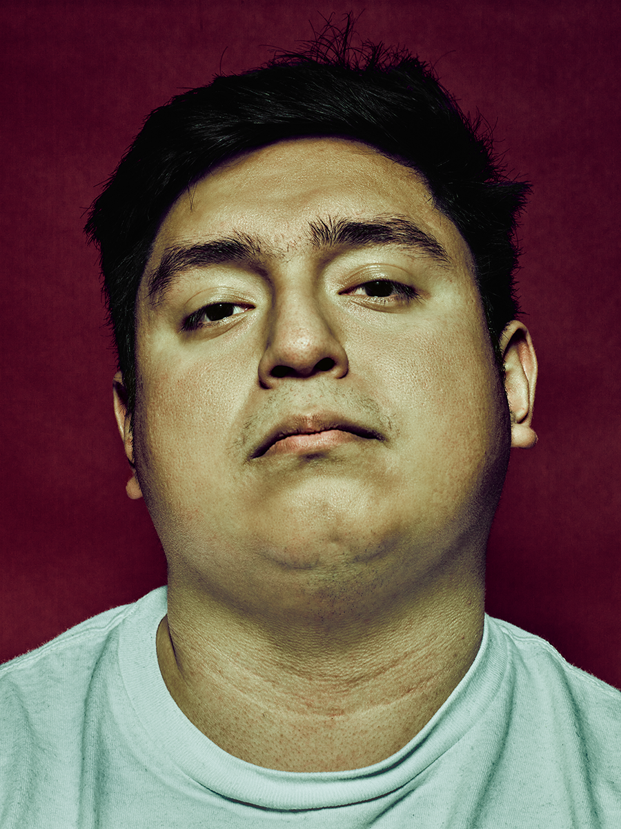 Tommy Romero_Studio Portrait_Red Backdrop copy.png