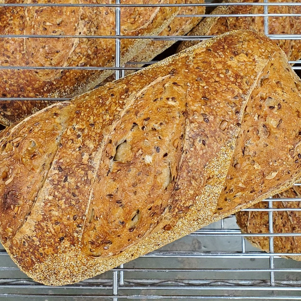 Good morning Thursday! We have a great variety of our  sourdough loaves here in the shop, including Seriously Seedy featured here. The bakery is open till 6 today. We'd love to see you, so stop on by 😁

 #sourdough #blacksburgbagels #localbusiness #