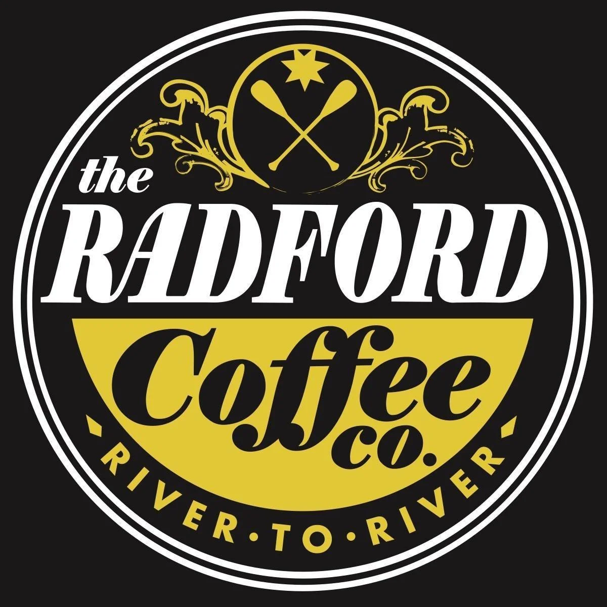 Logo for The Radford Coffee Co., featuring a circular design with the company name and a black background. The logo includes a yellow semi-circle with the word 'Coffee' in black script, crossed spoons and a star at the top. The phrase 'River to River' appears around the bottom edge of the circle.