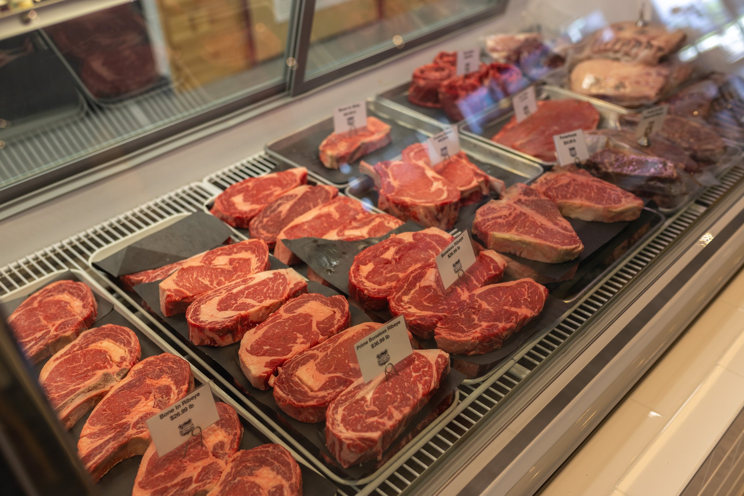 Clines Custom Meats Selection of Ribeye Steaks in Cold Case.jpg
