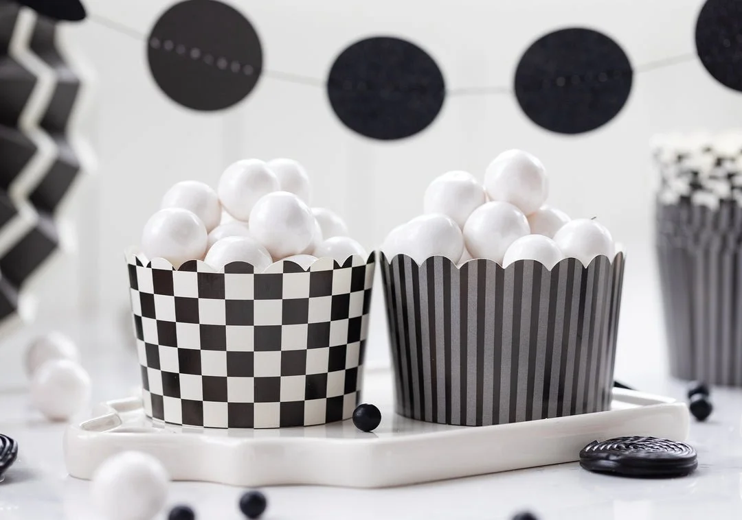 Halloween snack and baking cups in black-and-white striped and checkered designs for cupcakes, snacks, candy and party favors