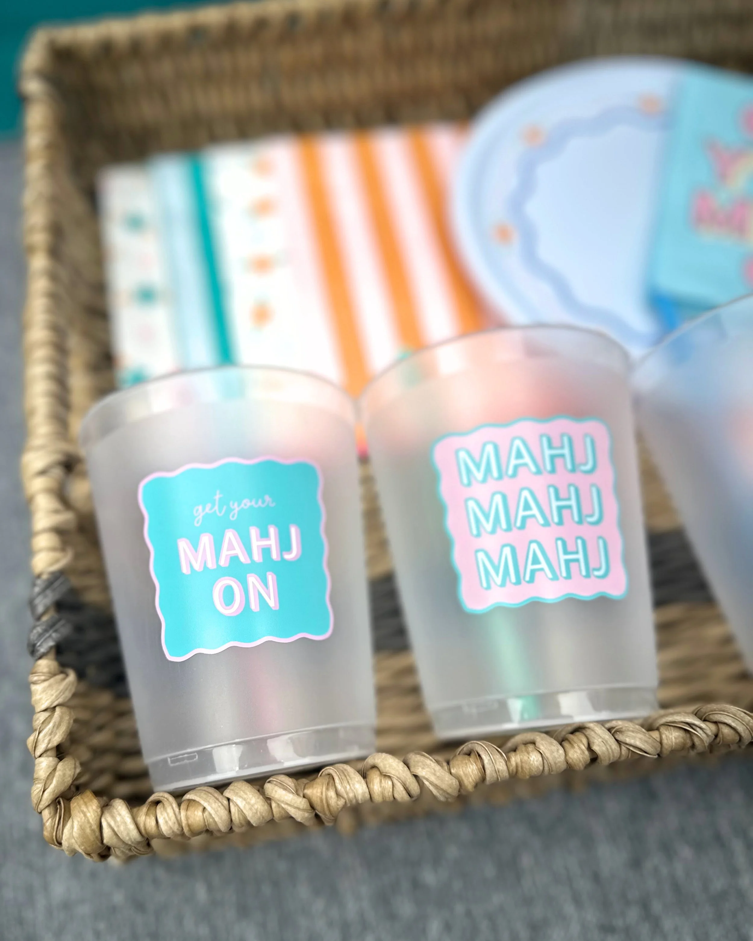 Reusable mahjong cups with Get Your Mahj On and Mahj Mahj Mahj designs, bright and modern BPA-free drinkware for game night.