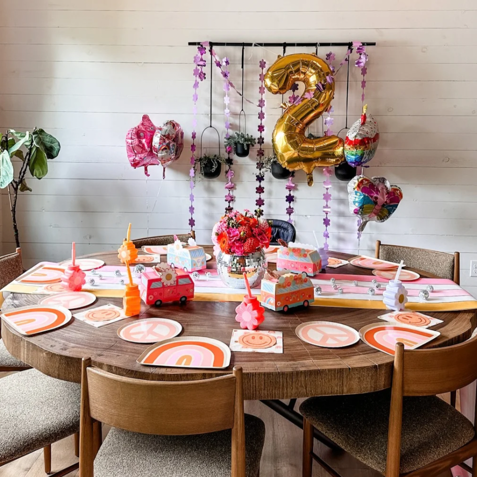 two groovy custom kids birthday party setup with tableware and decor in denver