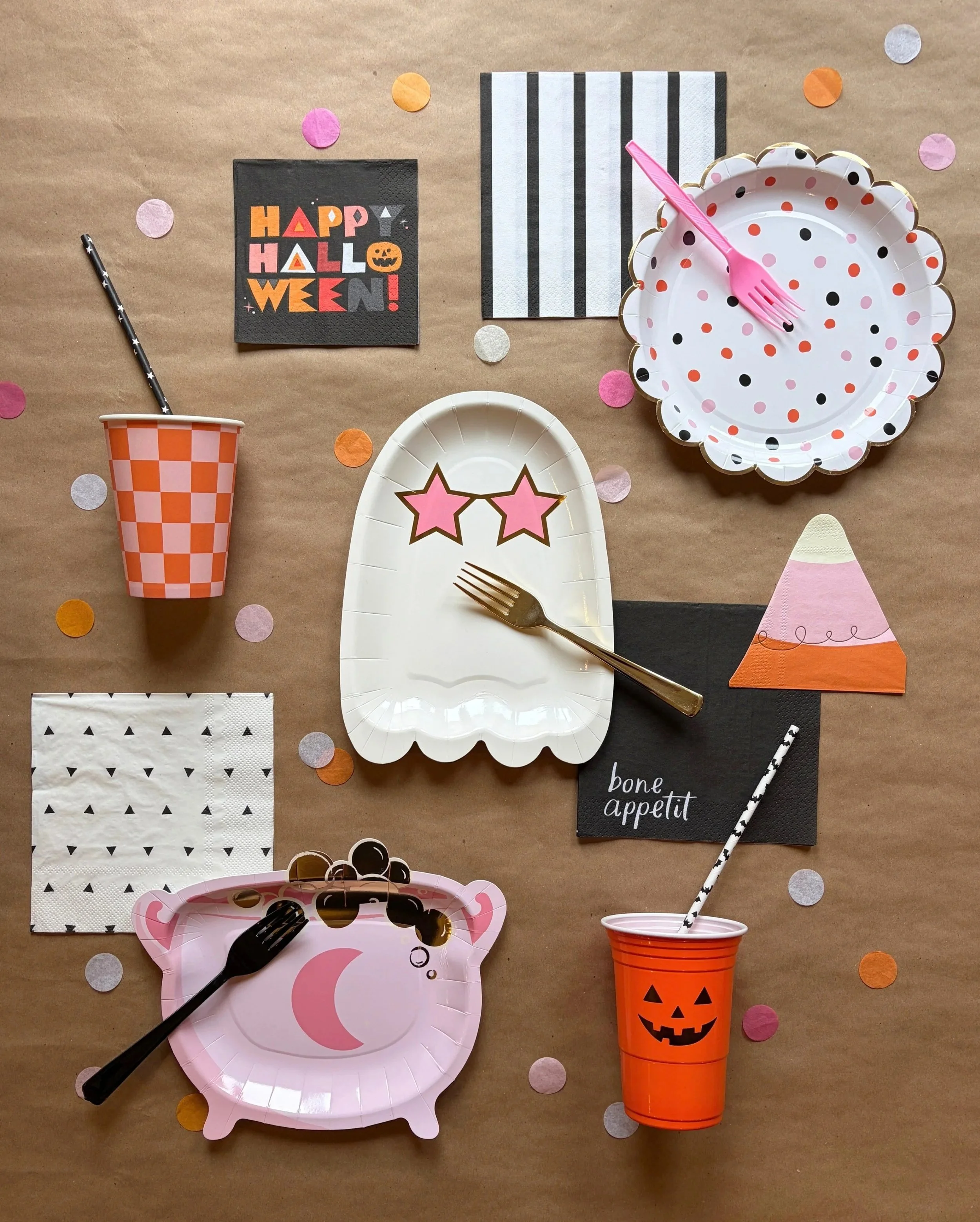 Showghoul kids Halloween activity box with coordinating Halloween tableware in pink, orange, white, and black