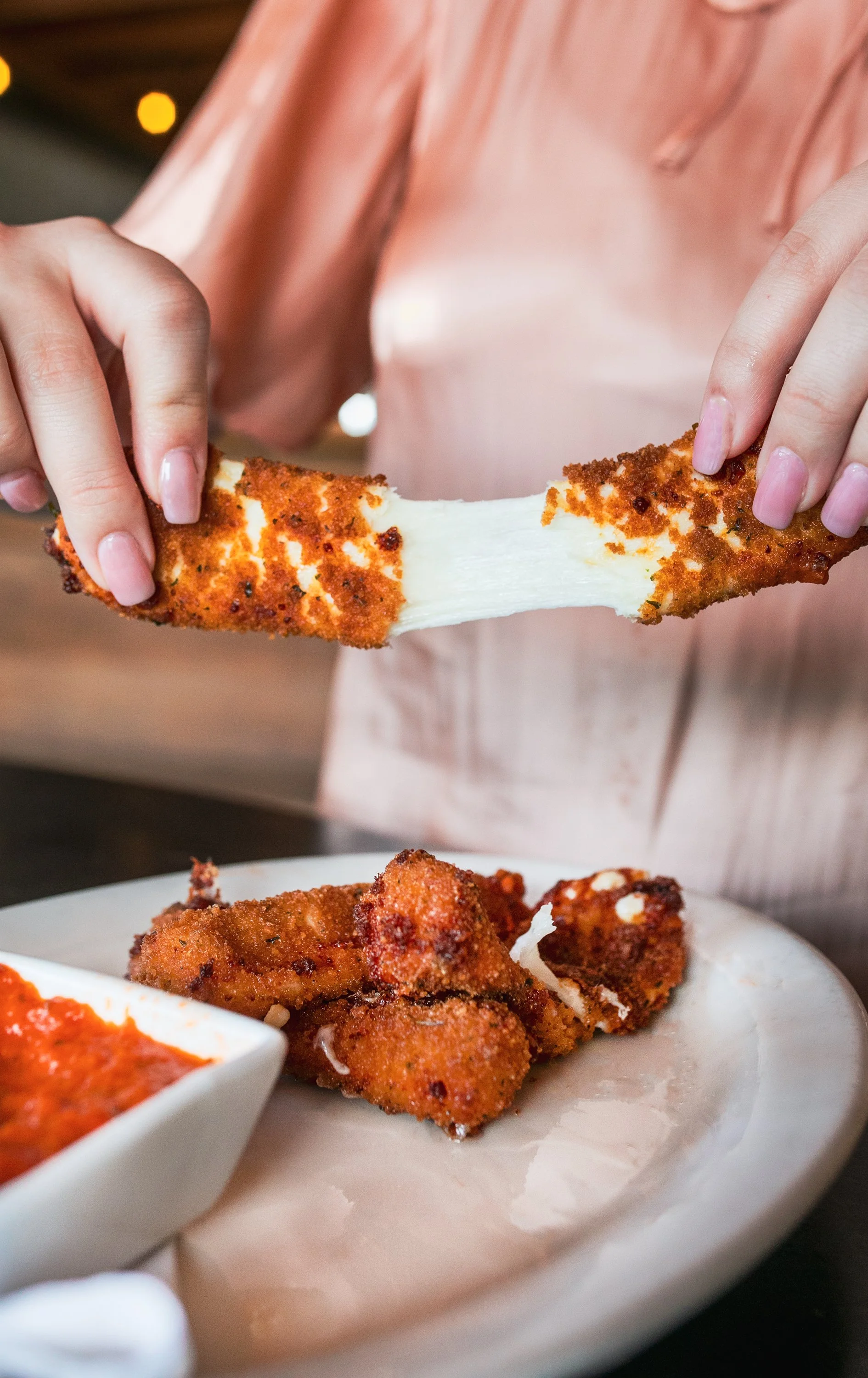 mozzarella sticks bring torn to show cheese