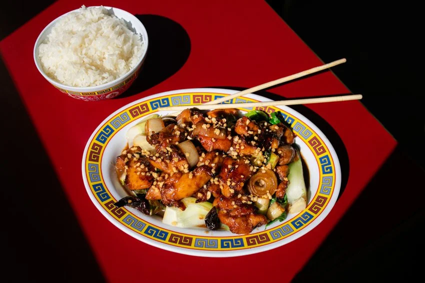 a plate of food with chopsticks