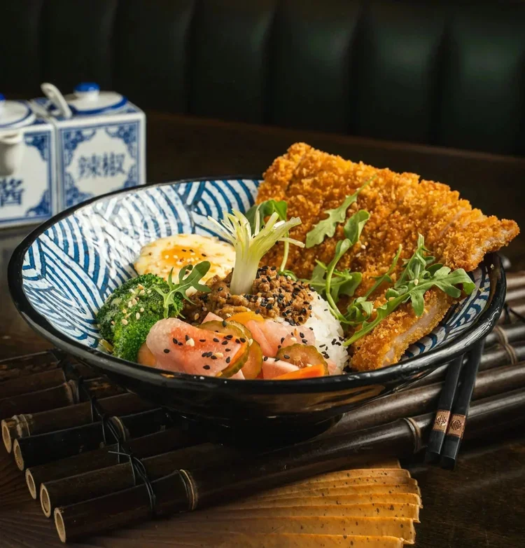 fried pork chop over rice in Rosslyn Arlington