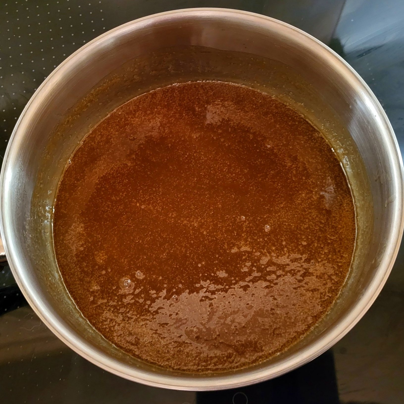 Brown sugar dissolved in a saucepan
