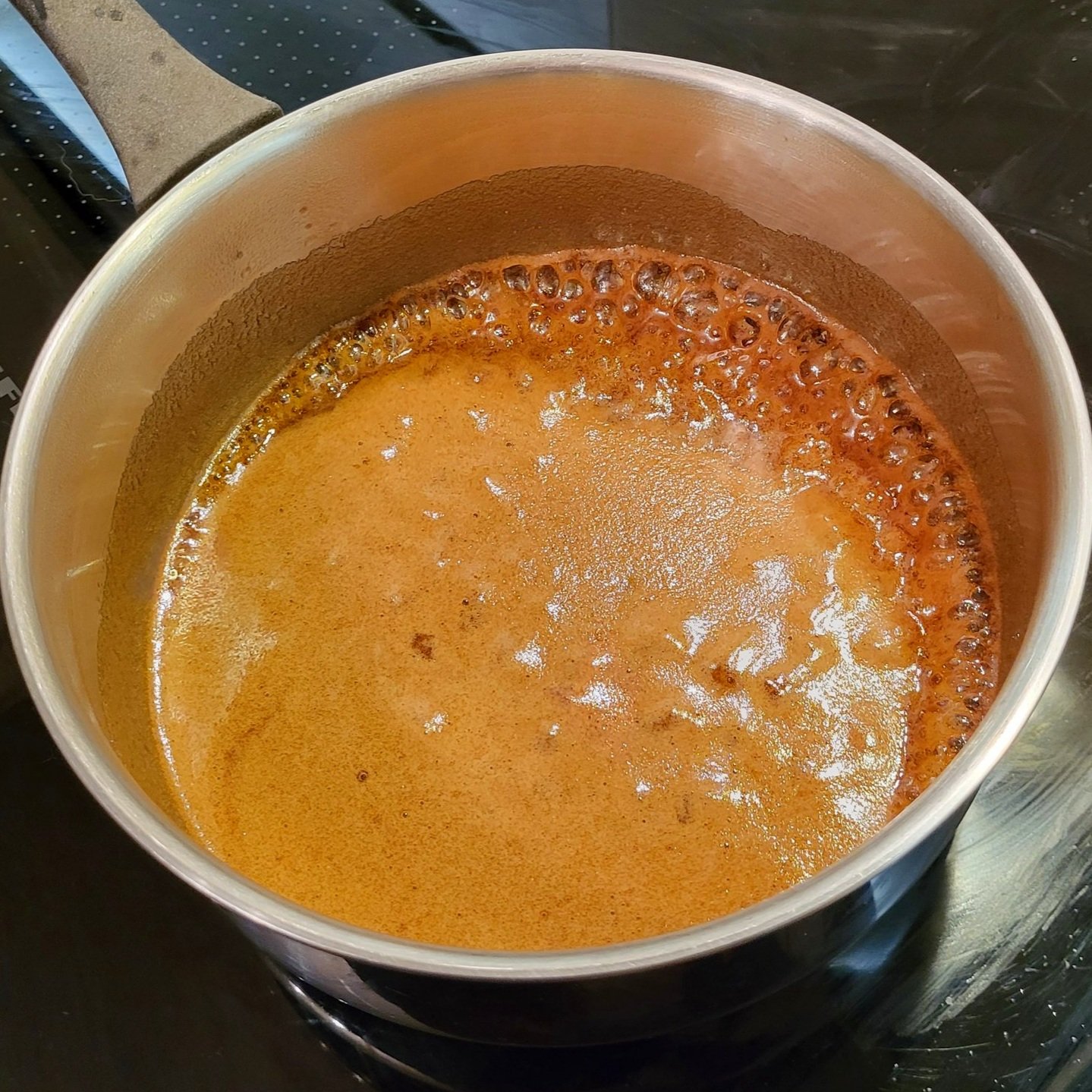 Caramel made in the pan with a rolling simmer