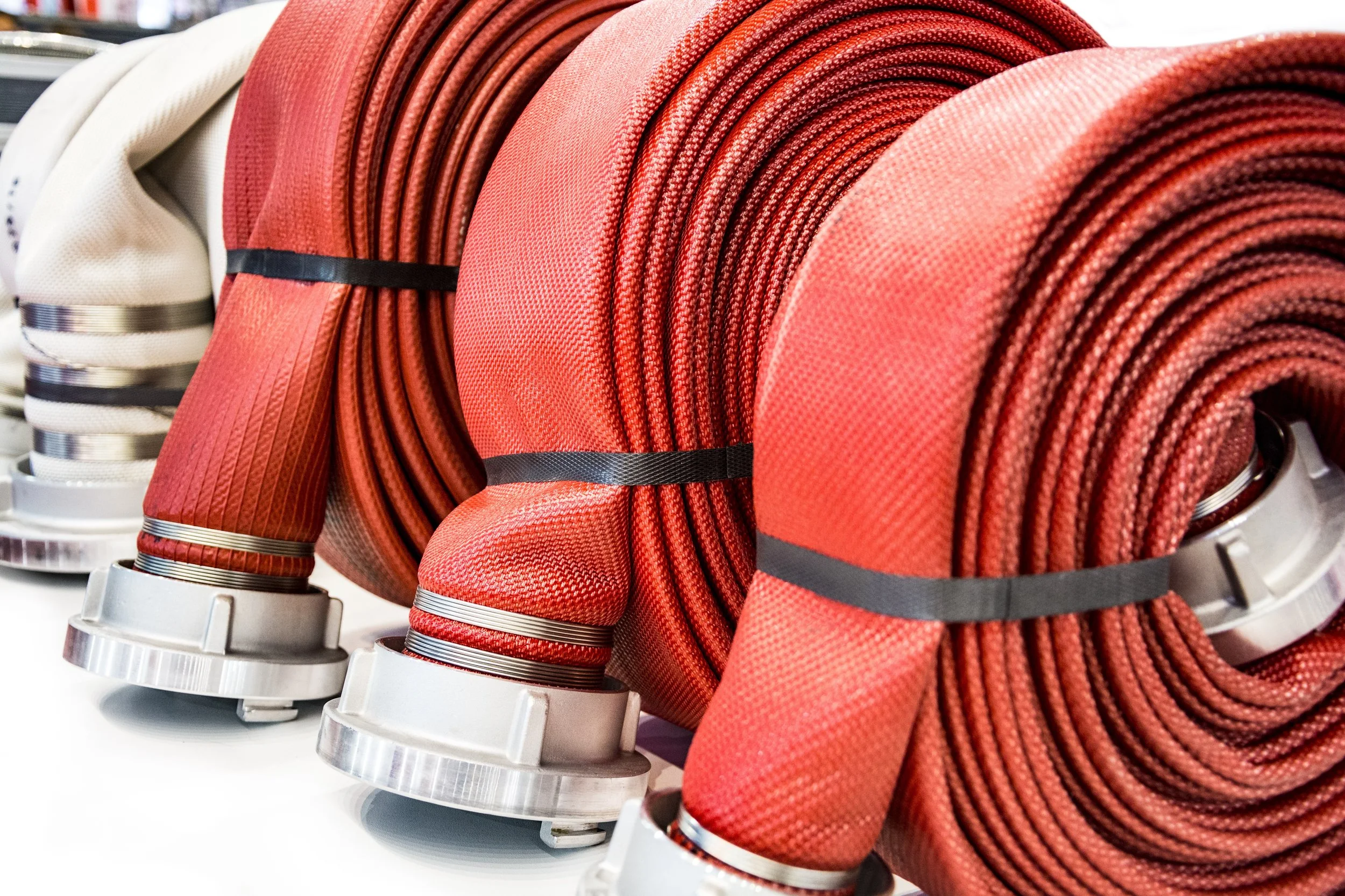 Multiple rolls of fire hoses as fire system