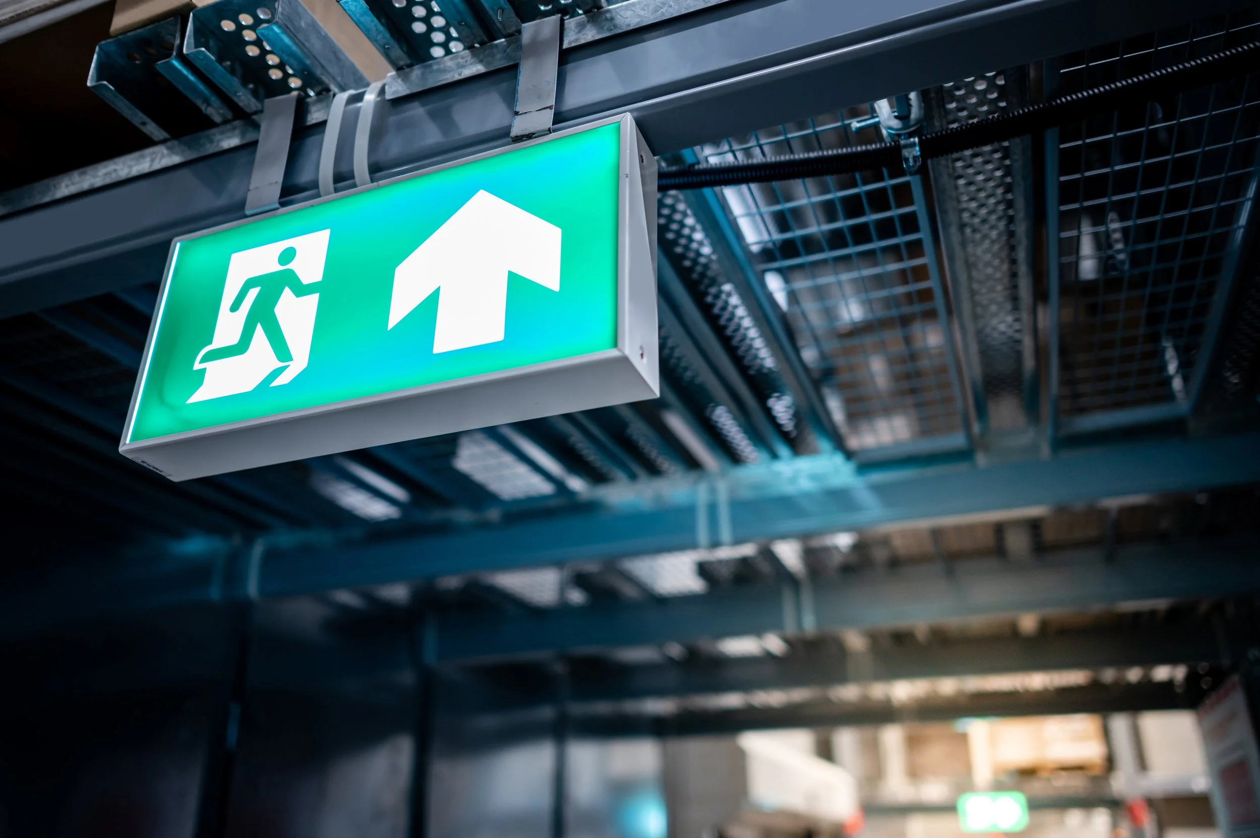 Emergency exit signs and lighting as fire protection system
