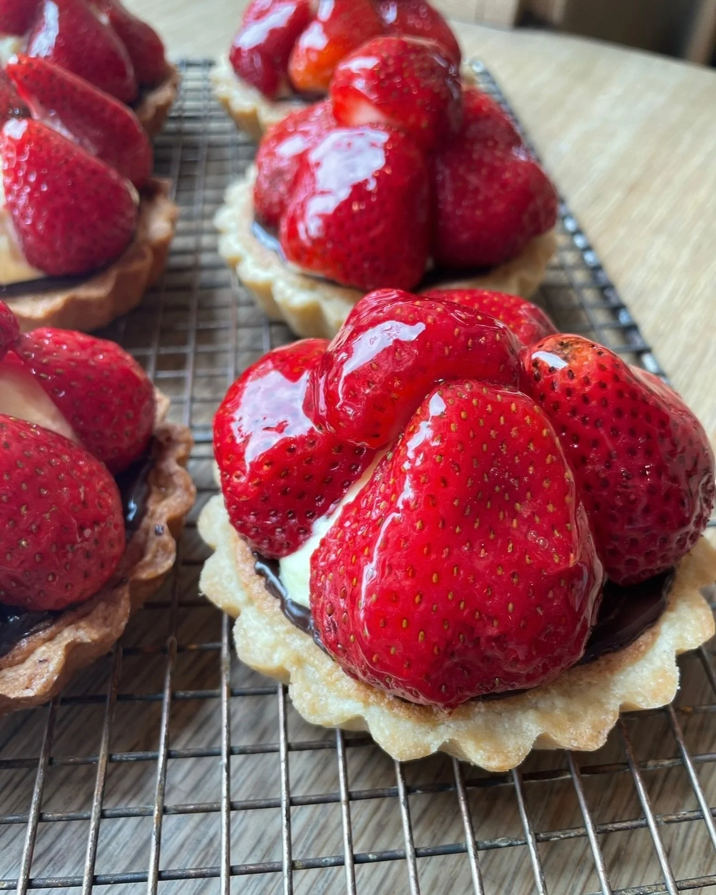 Weekend special alert! 🍓As the local strawberry season winds down, we couldn&rsquo;t resist making this classic Danish strawberry tart with pastry cream, almond mazarin and dark chocolate. They are individual-sized so you don&rsquo;t have to necessa