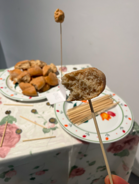 Her Ideas, 2023, bread, wood sticks, Pesos, paper, and a curtain, dimensions vary 