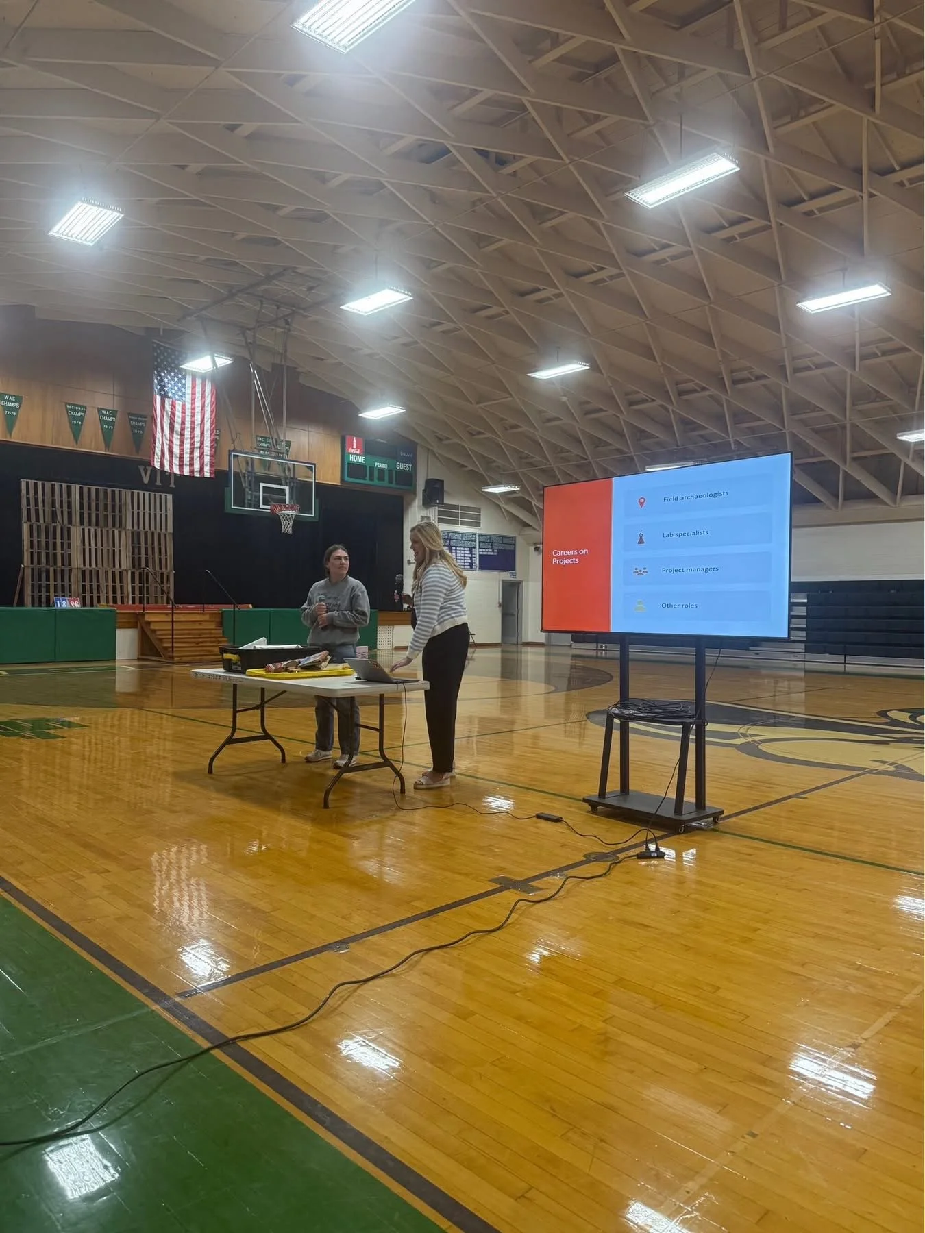  Amanda presents career opportunities in clean energy and archaeology to an attentive student audience at the VIT Community Unit School District #2 gymnasium. 
