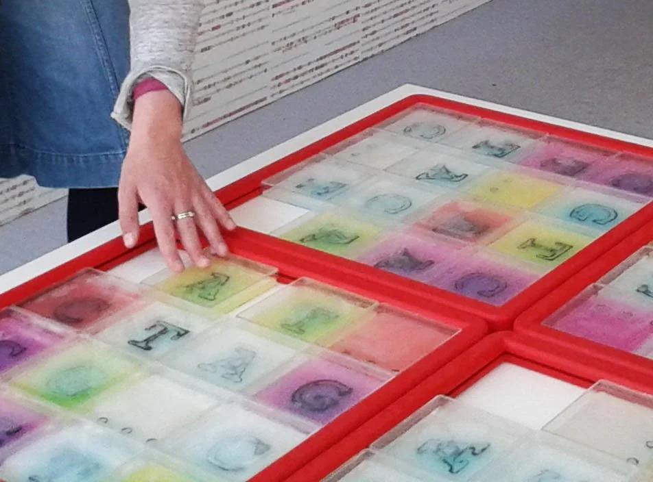 Slider Puzzle, 2015. Agar ink and 15 petri dishes in a frame. Interactive investigation of the order of A, C, G and T, from Genome Games project