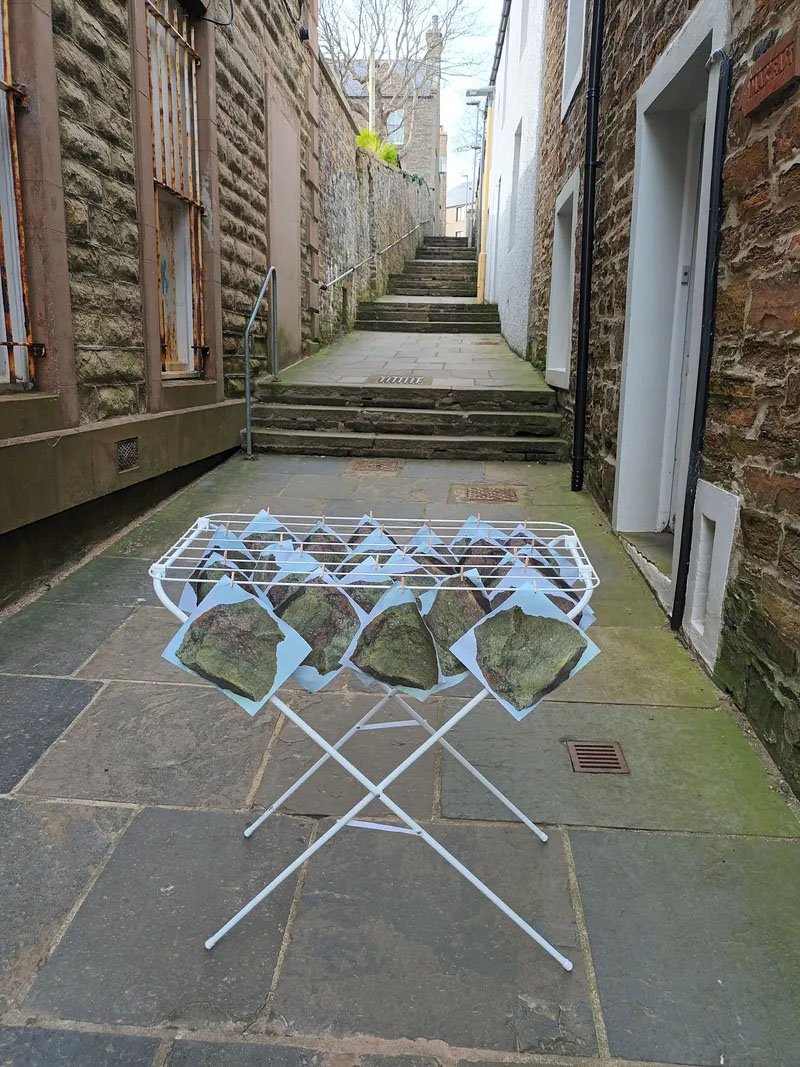 Looking Back, 2025. Photos of The Same Rock on a drying rack in Manse Lane. From the 900 Years of Edinburgh project
