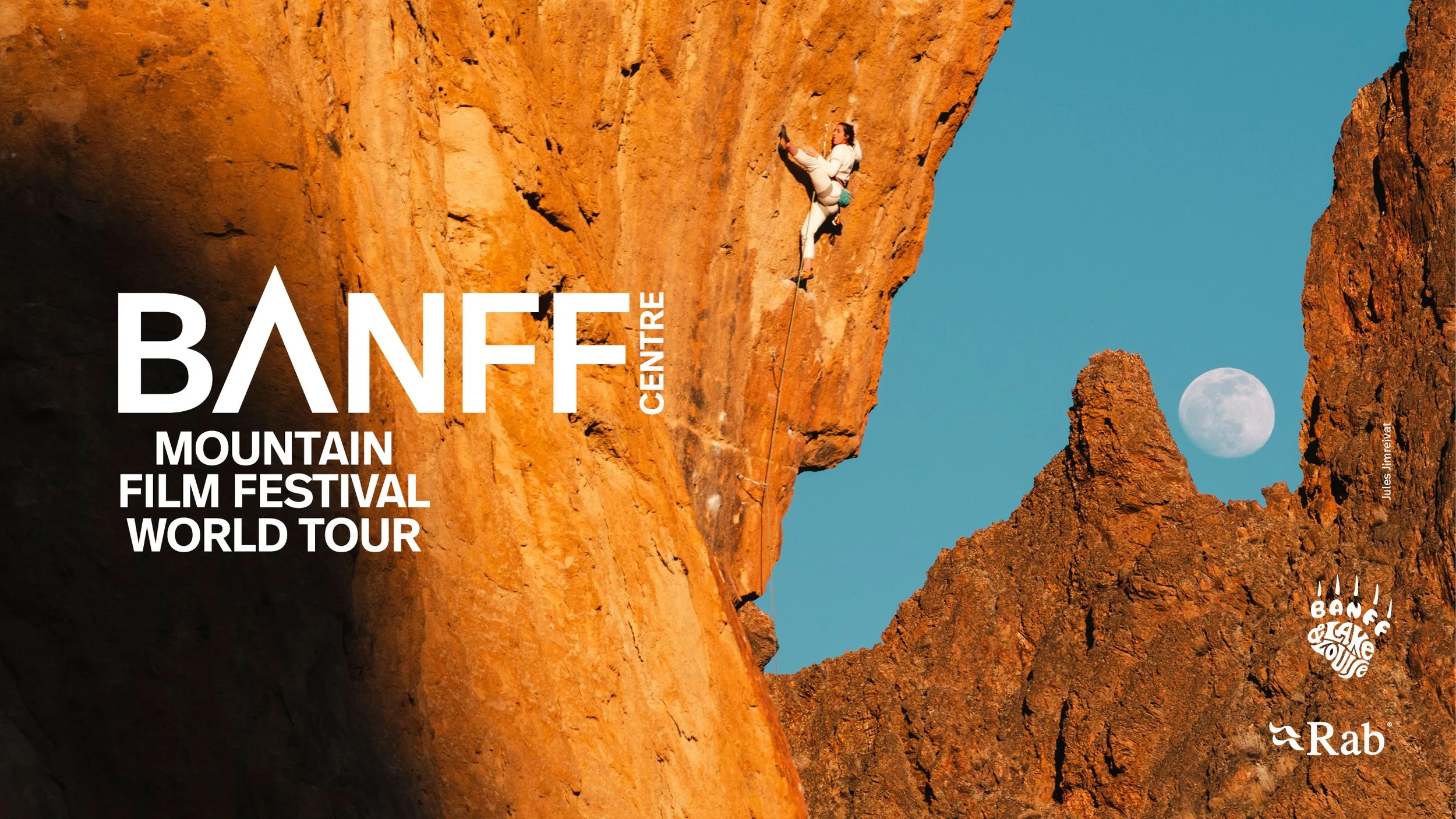 a silhouette of a person belaying on the mountain with a starry backdrop 
