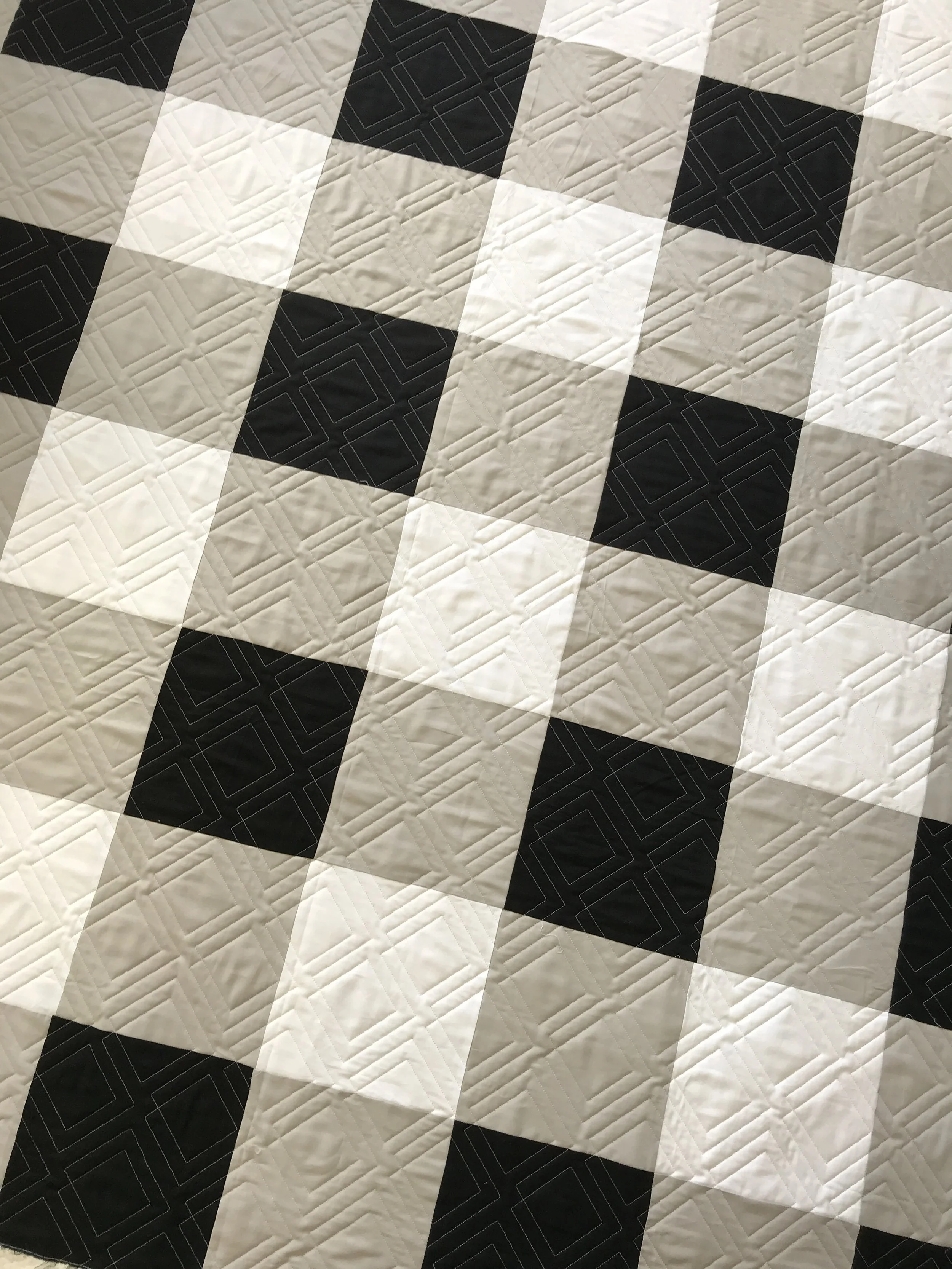 Skye’s giant buffalo plaid quilt