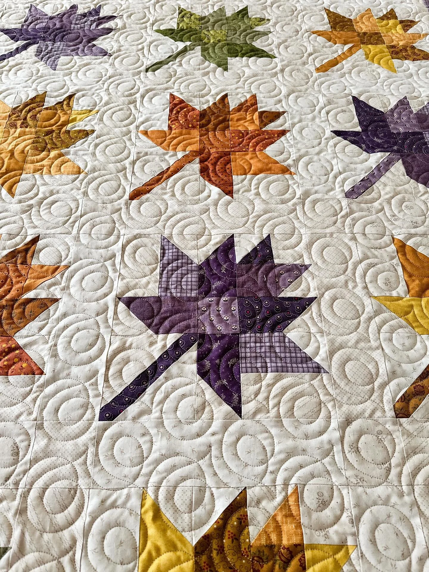 Have you started to feel a little nip in the air?  I did last week but this week has warmed right back up.  Now is the perfect time to get that fall leaf quilt made, like this gorgeous October Morning Maple Leaves quilt that Jennifer made.  The patte